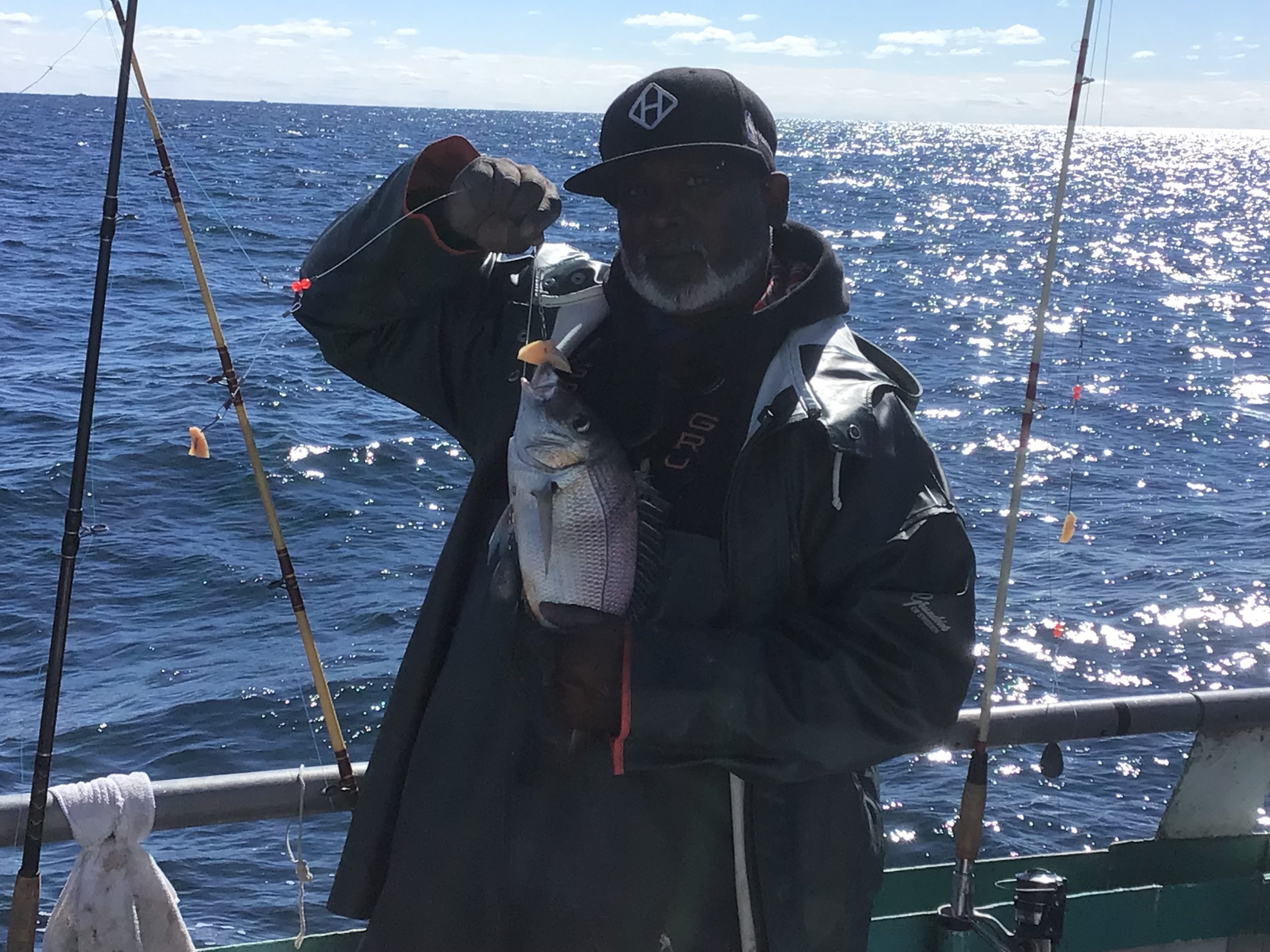 a person standing next to a body of water