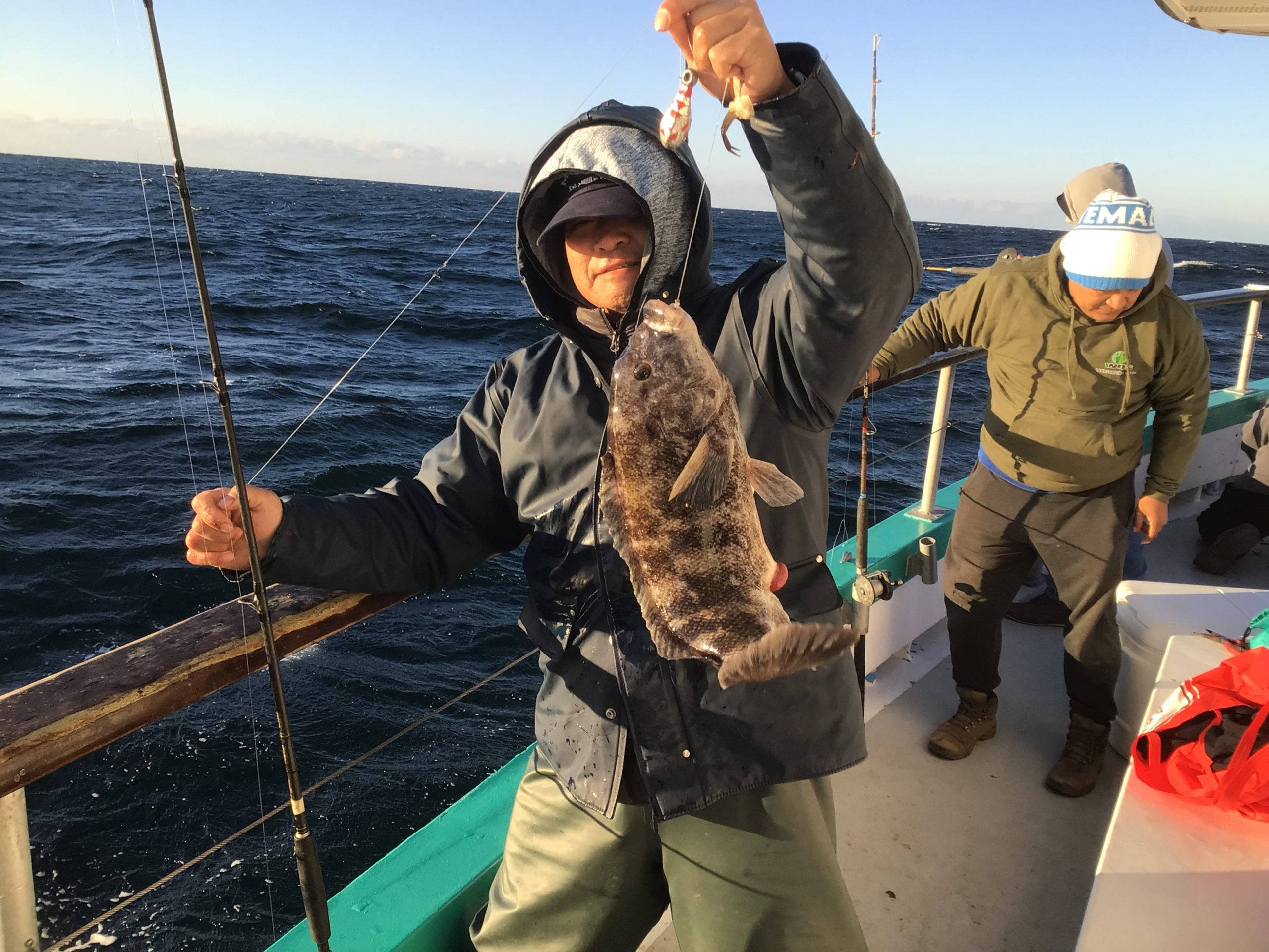 a person standing next to a body of water