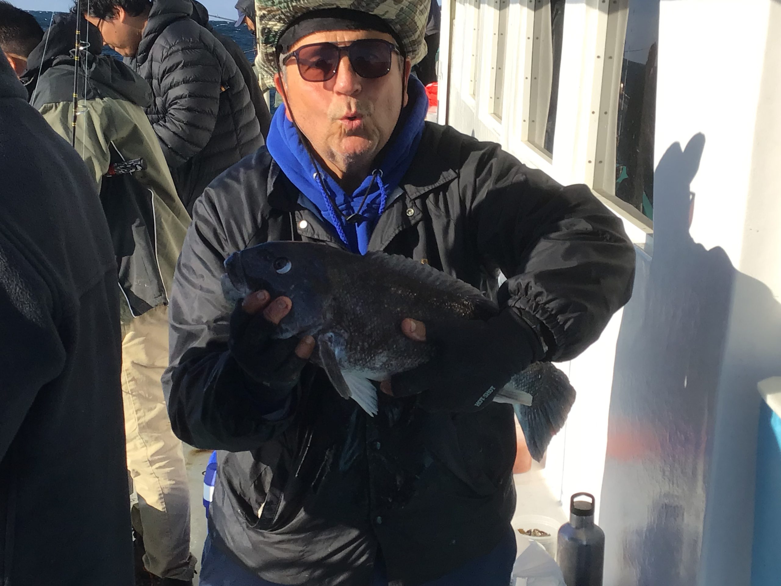 a man holding a fish