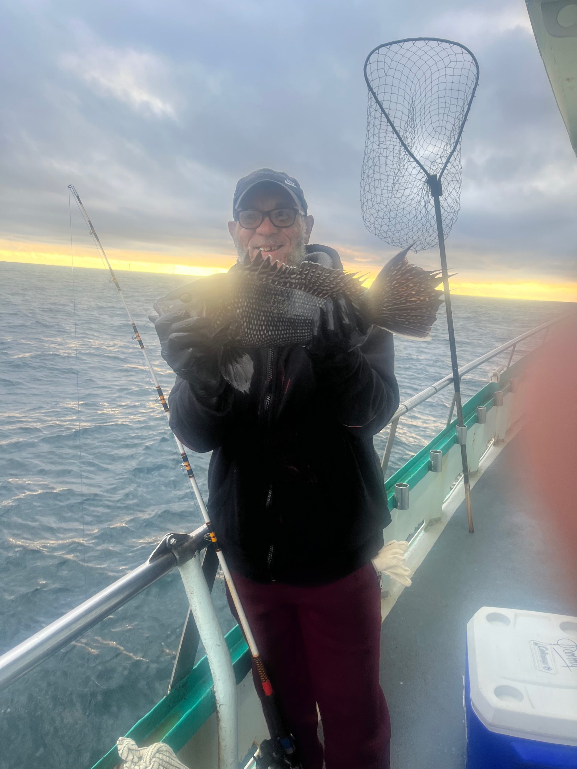 a person standing next to a body of water