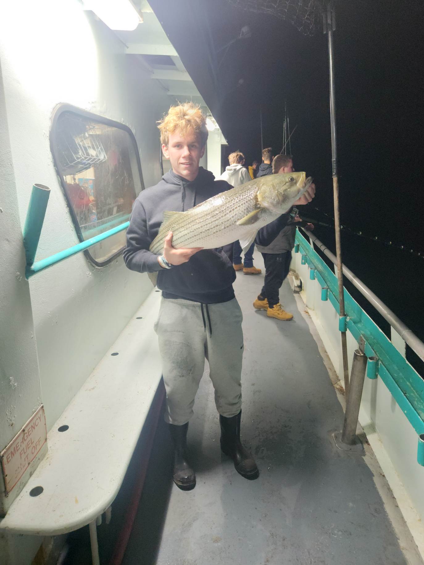a man holding a fish