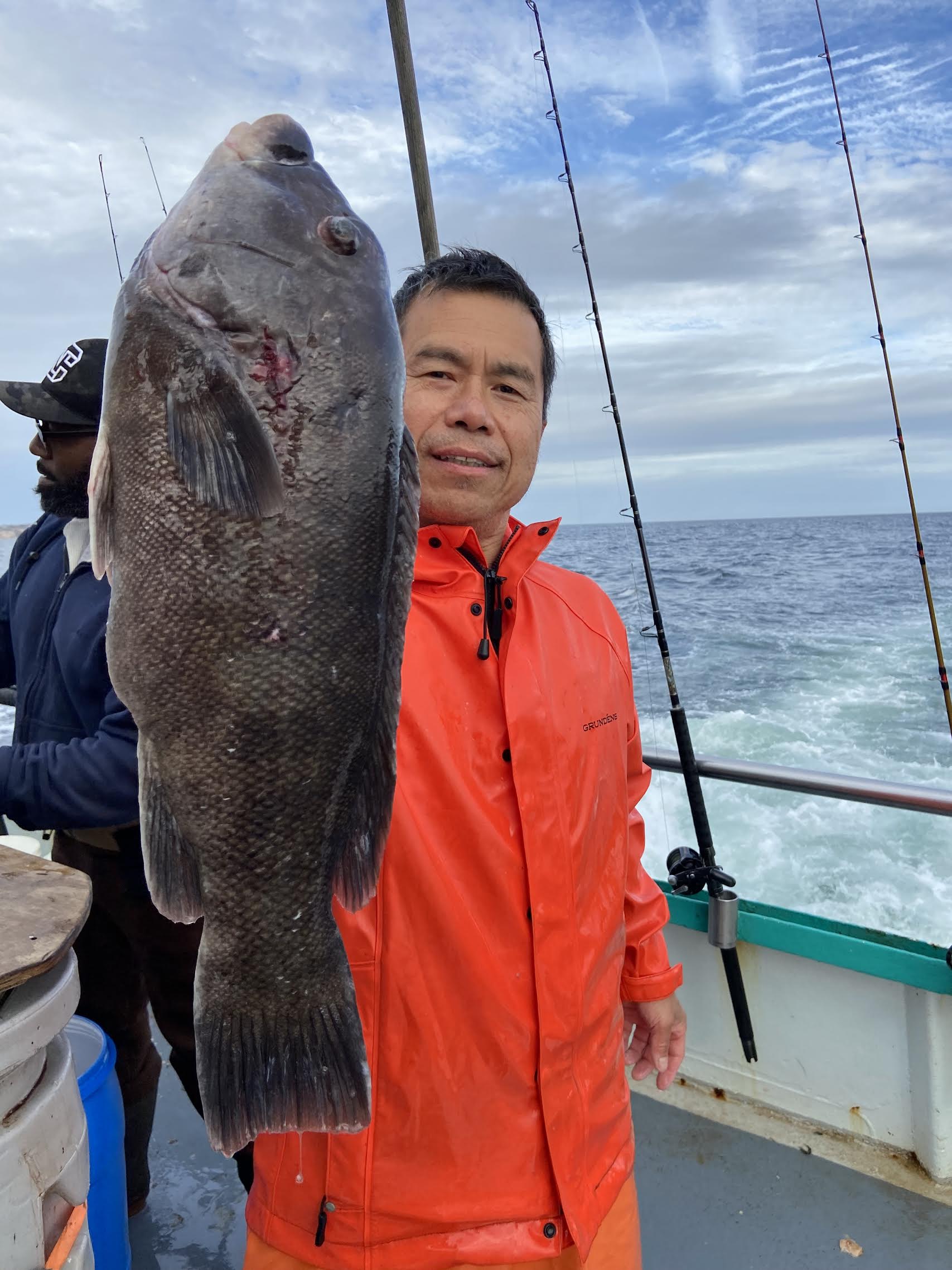 a man holding a fish