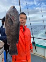 a man holding a fish
