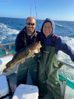 a person holding a fish in the water