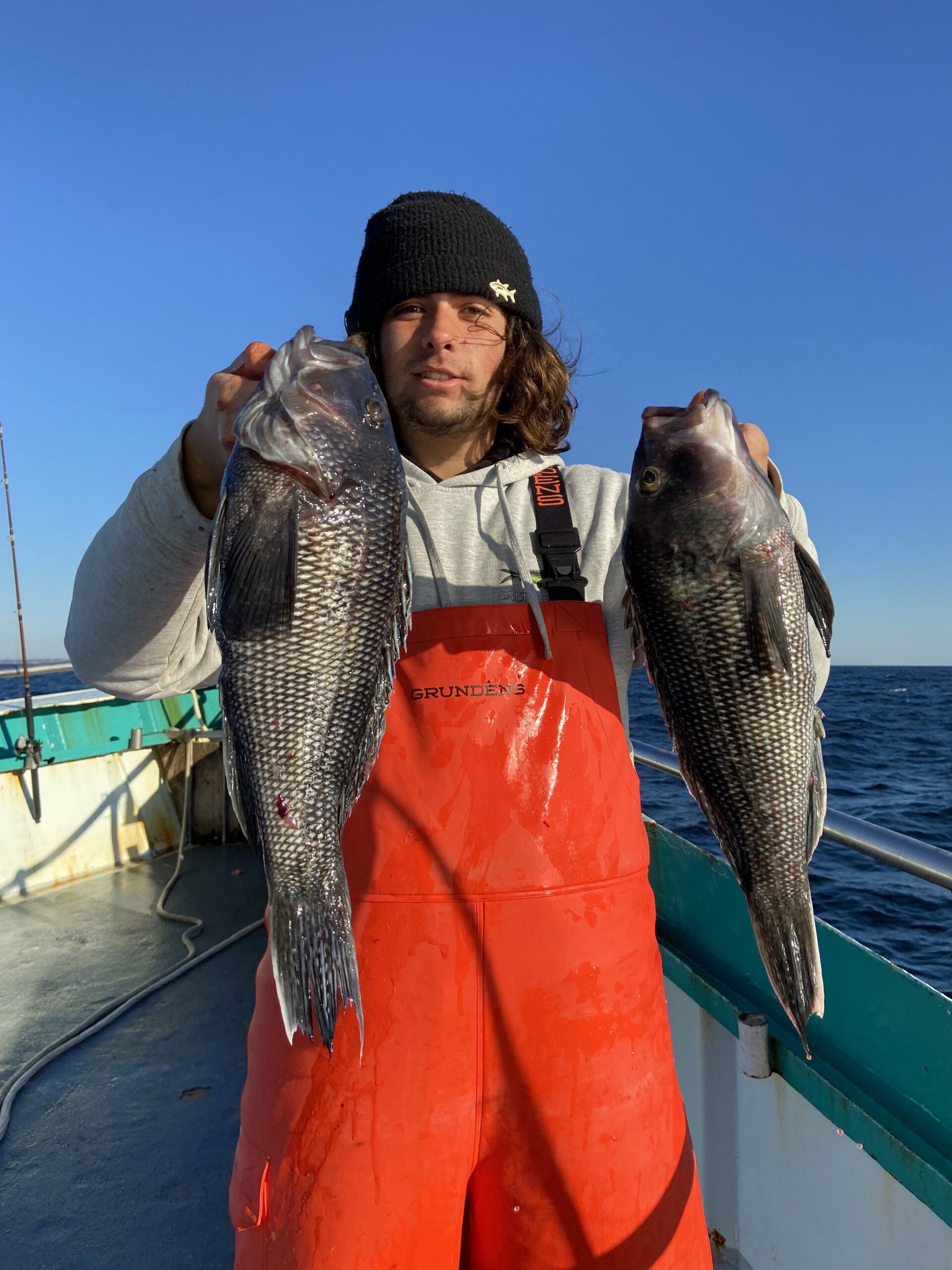a person holding a fish