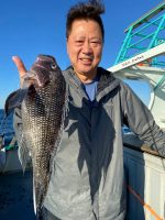 a man holding a fish