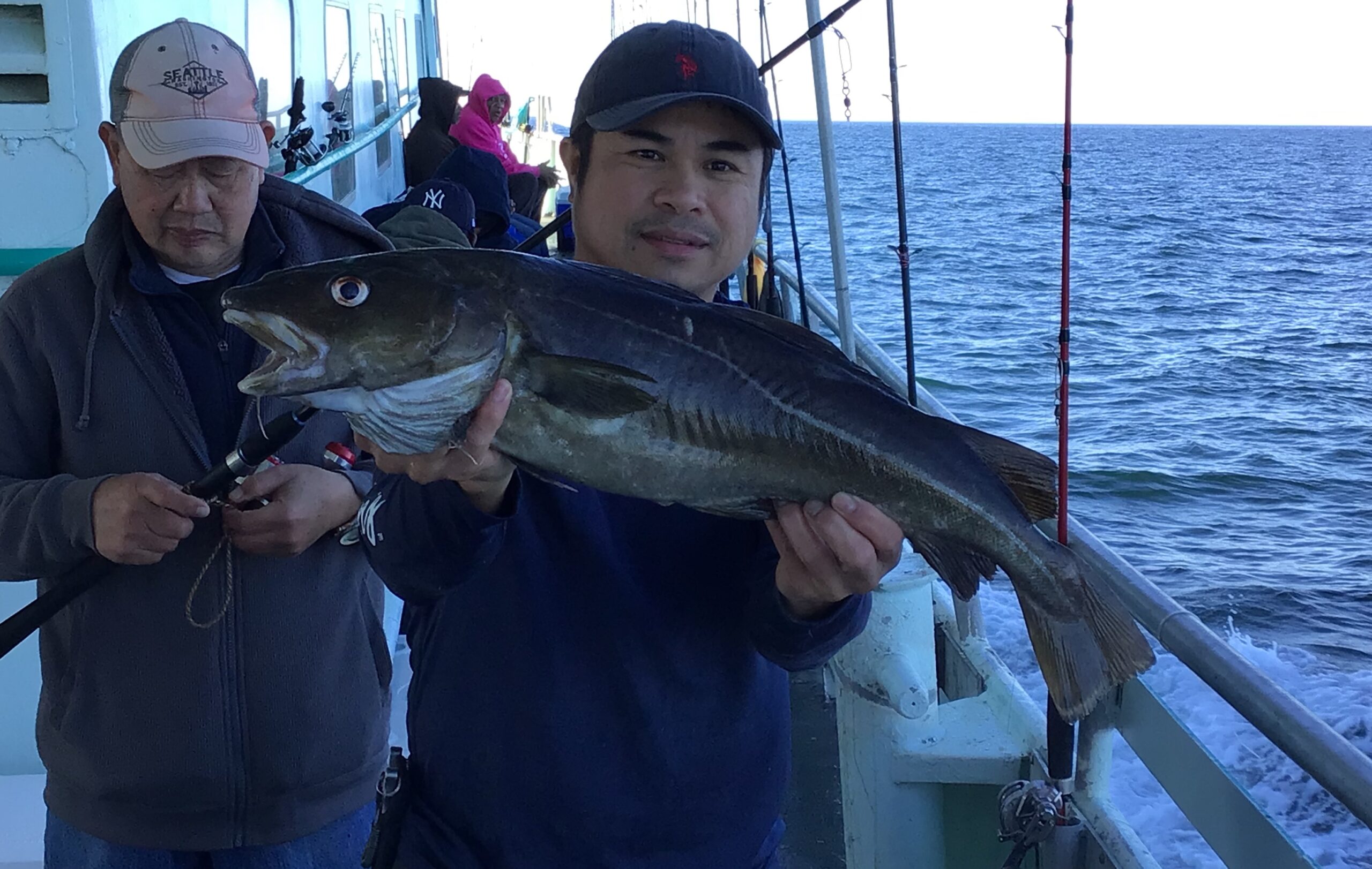 a man holding a fish in the water