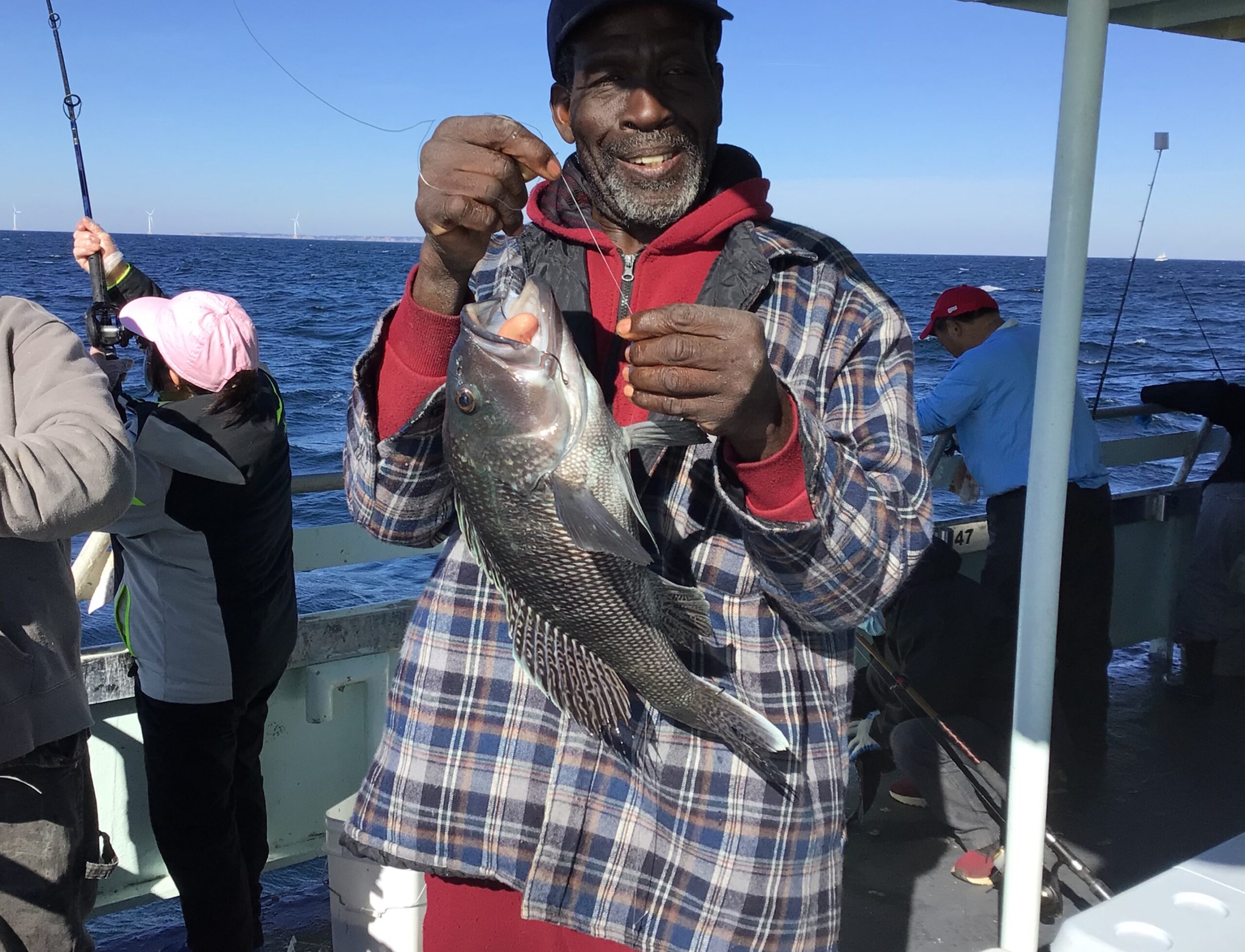 a person holding a fish in the water