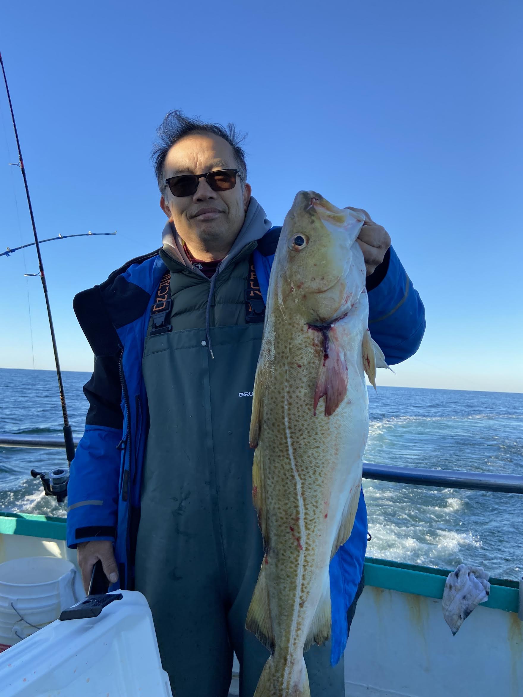 a person holding a fish in the water