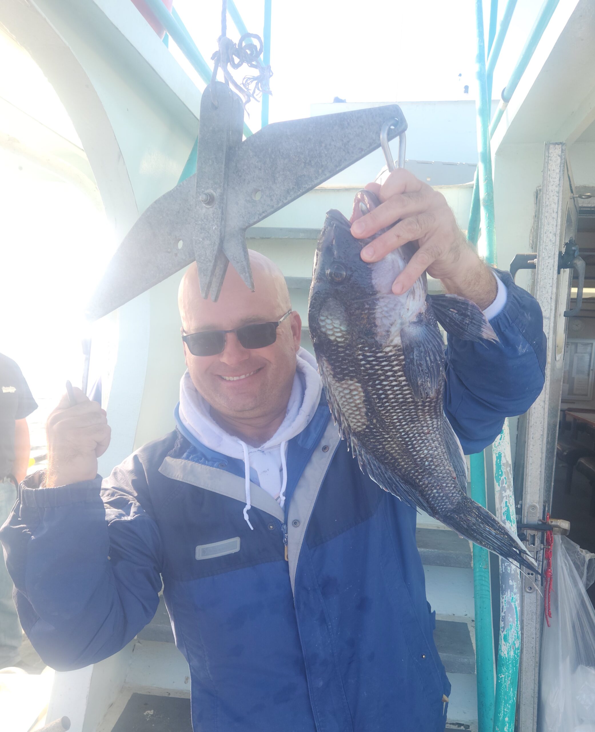 a man holding a fish