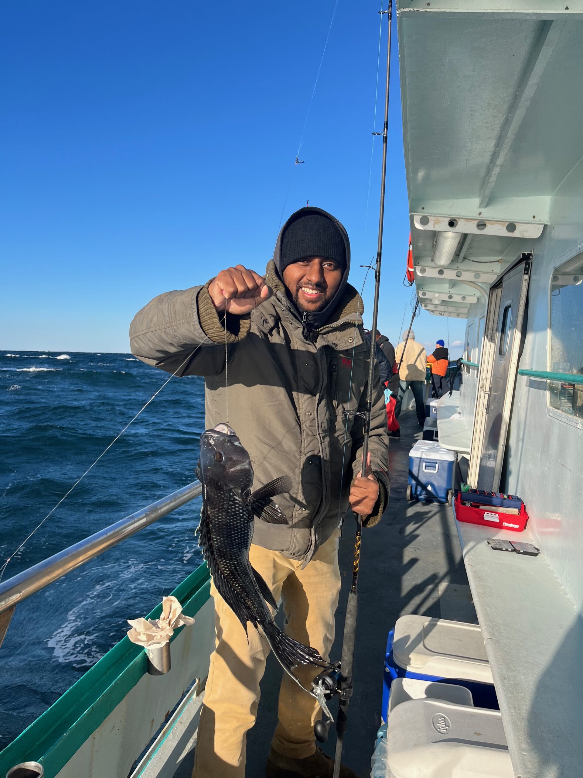 a person standing on a boat in the water
