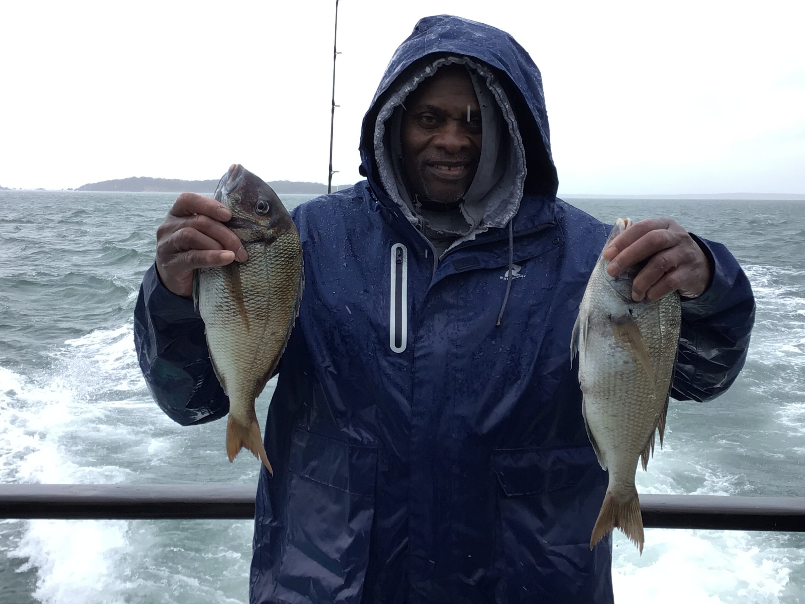 a person holding a fish in the water