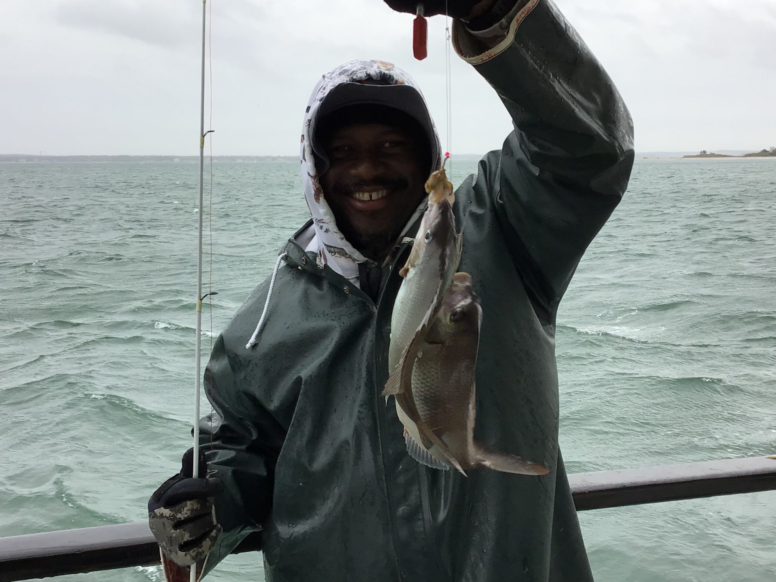 a person holding a fish in the water