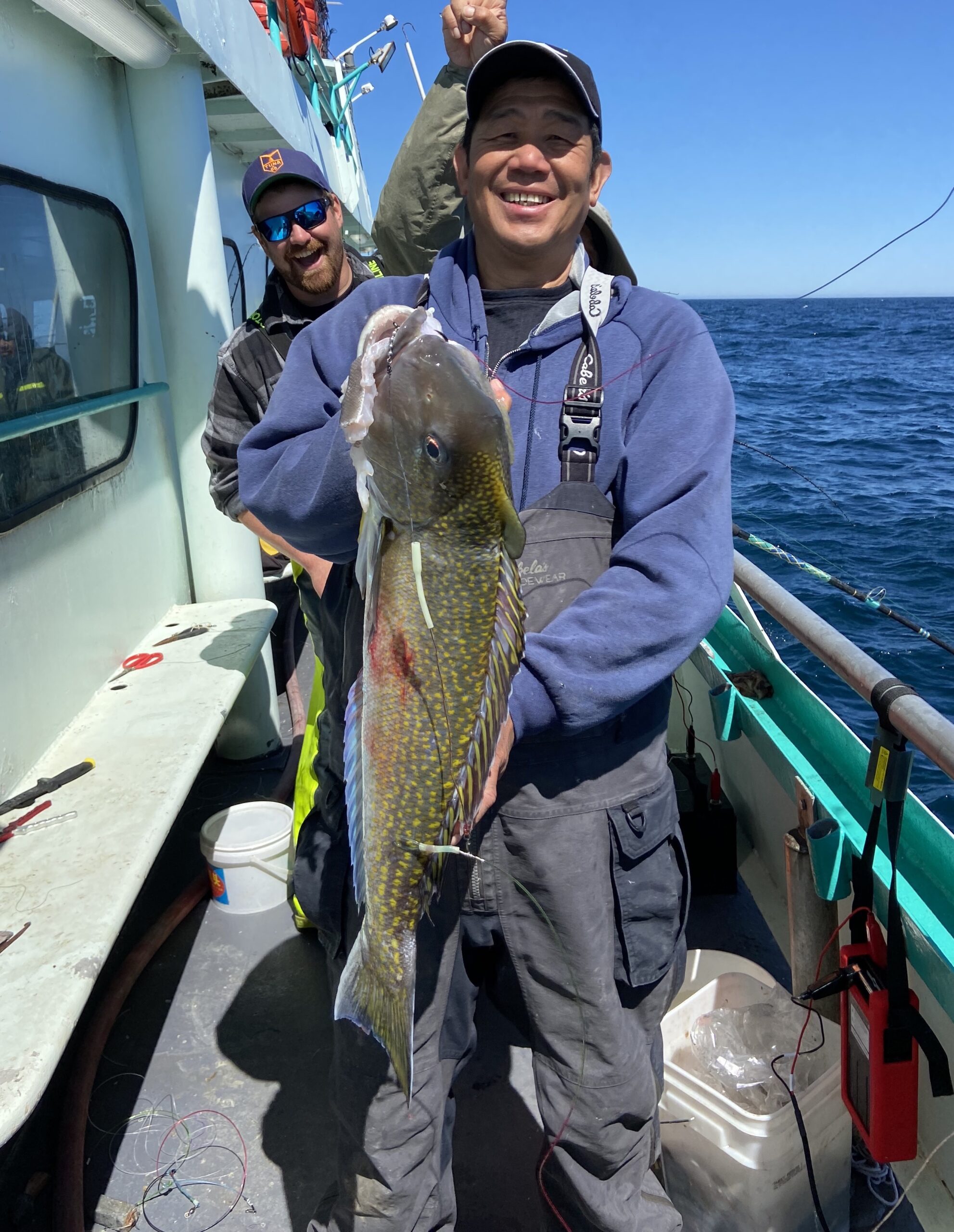 a person holding a fish