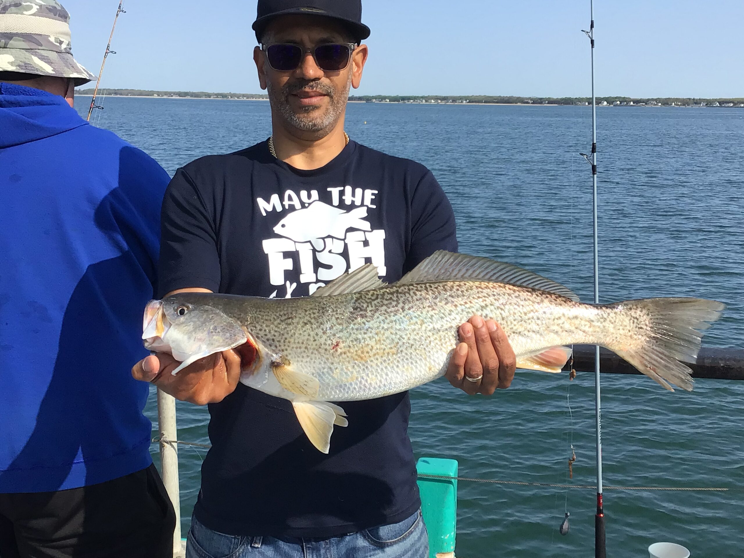 a man holding a fish in the water