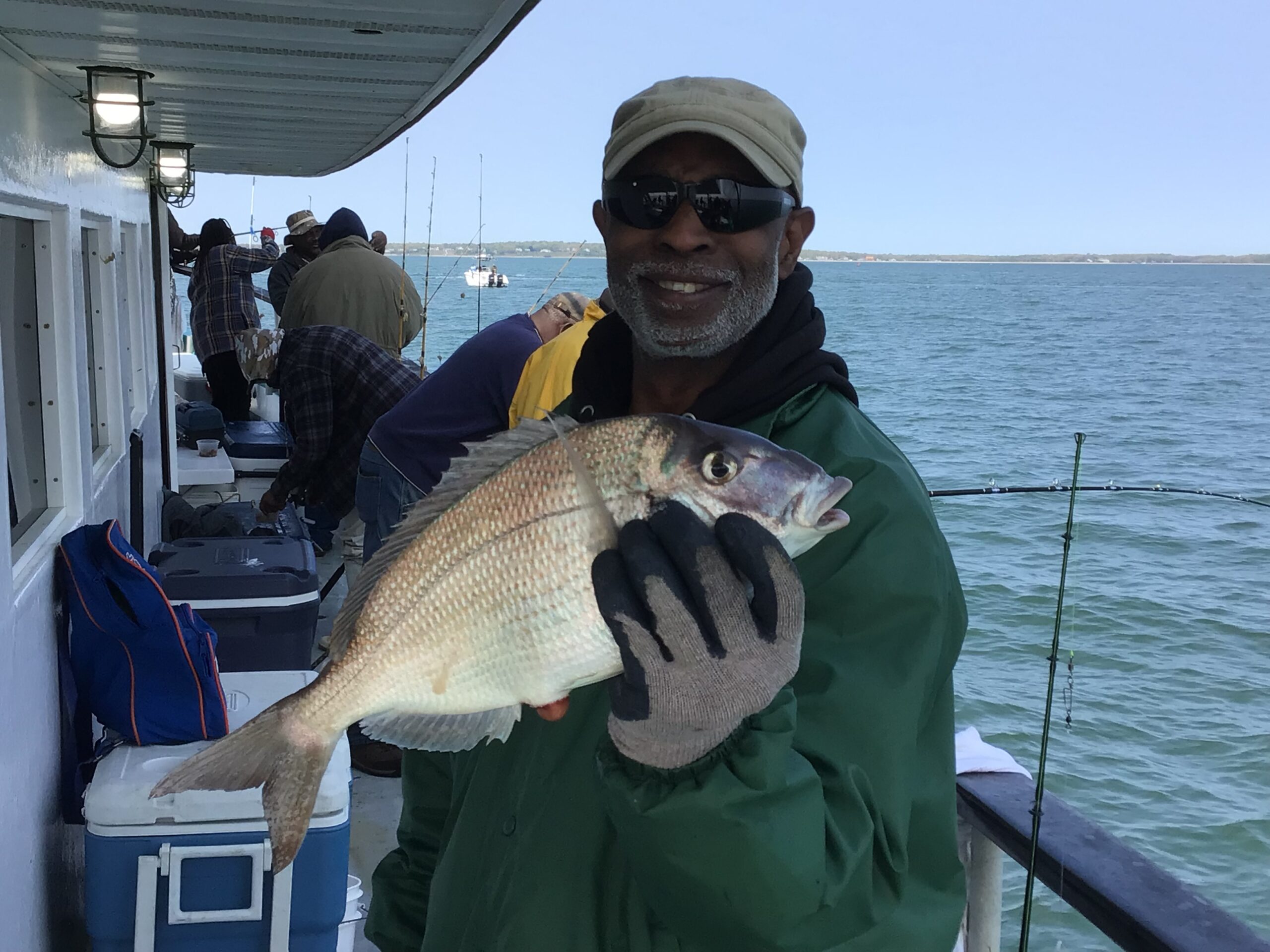 a person holding a fish in the water