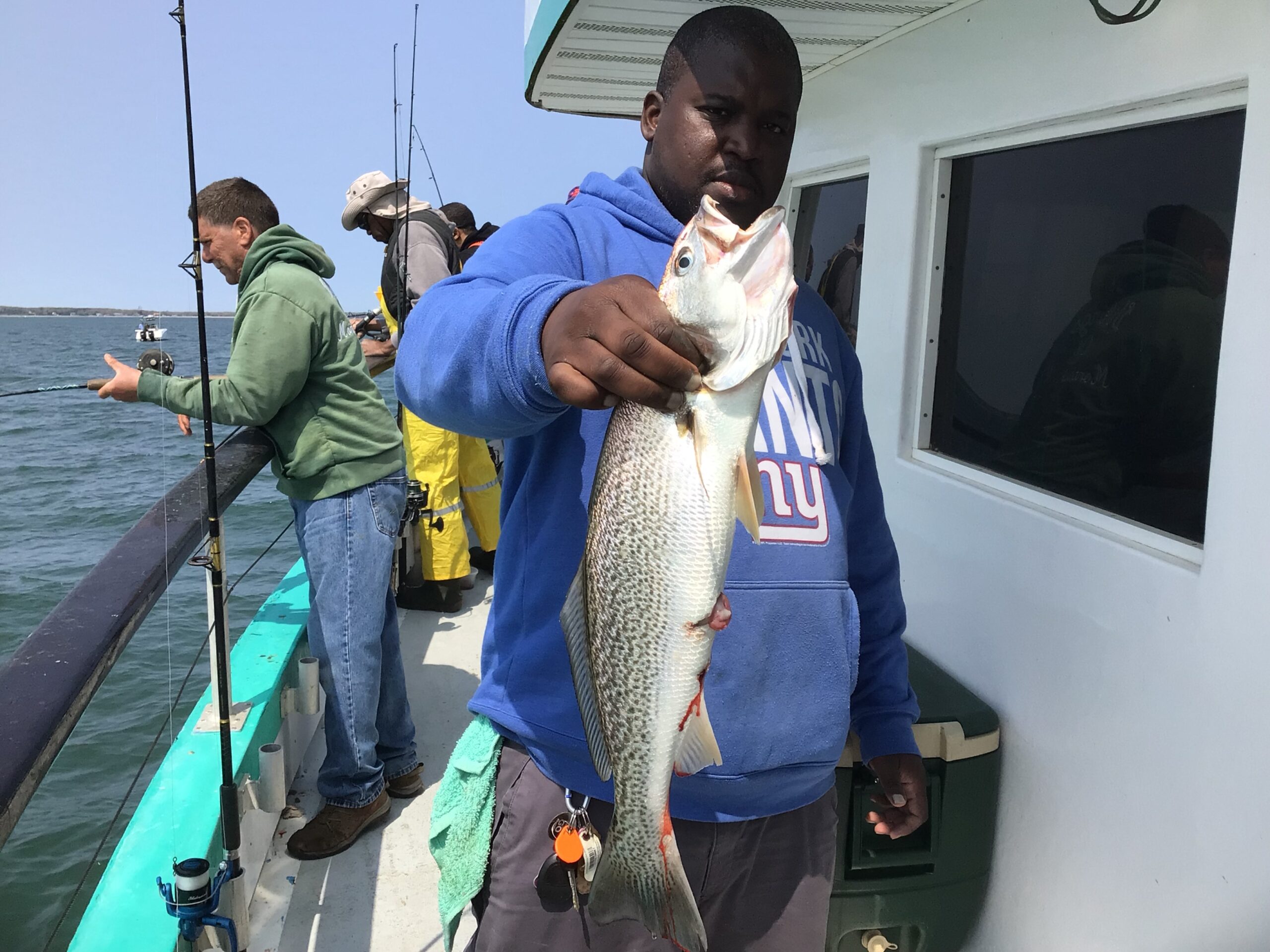 a man holding a fish