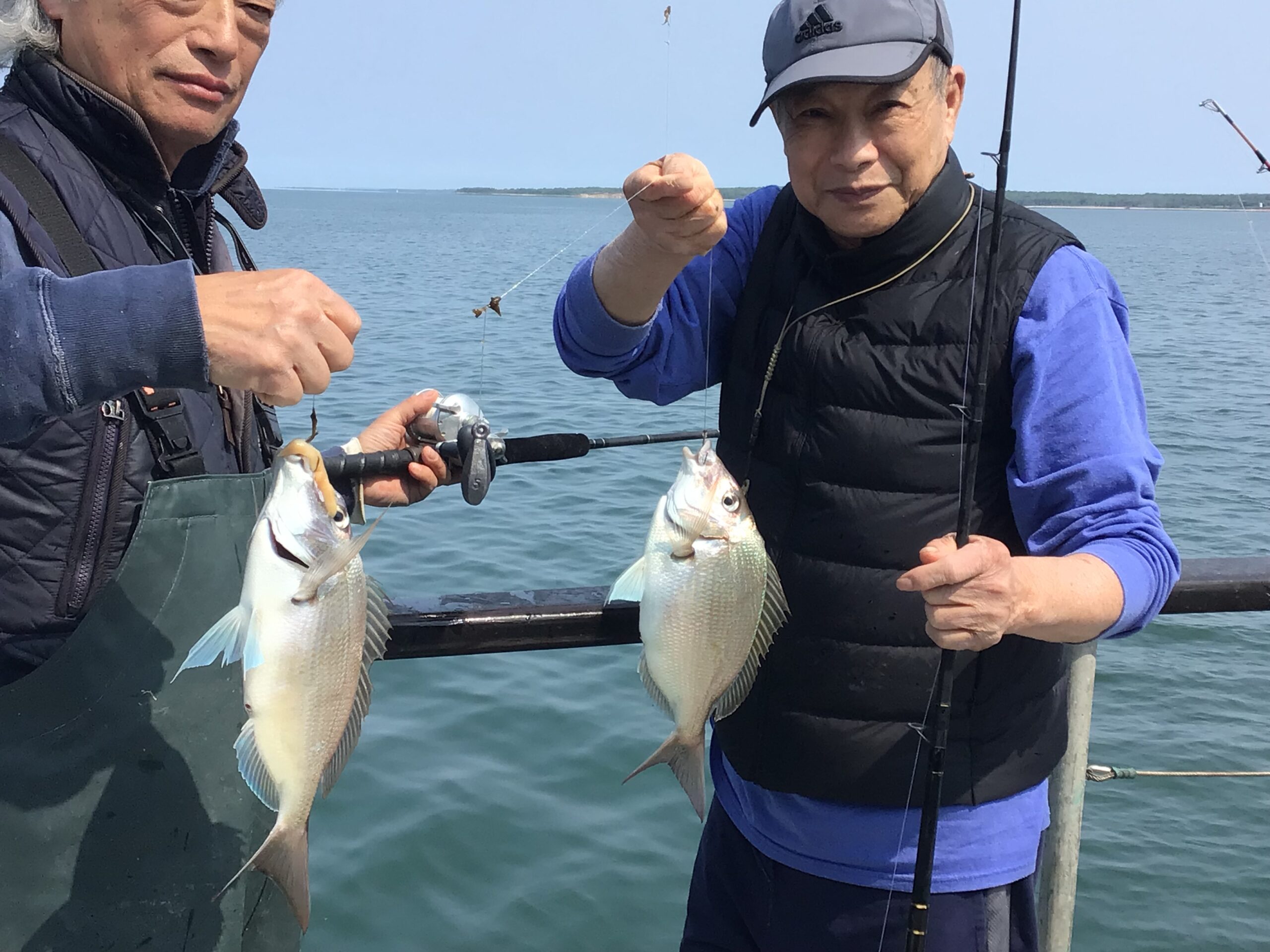 a person holding a fish in the water