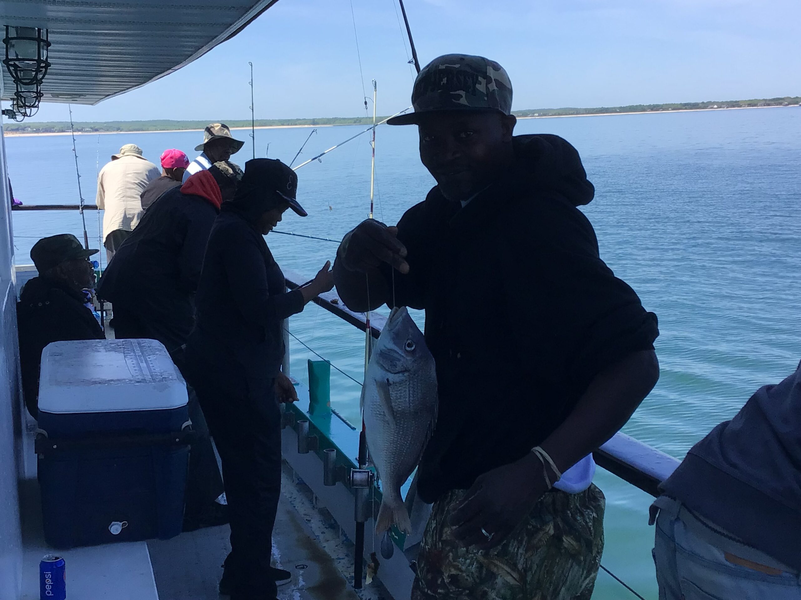 a group of people on a boat in the water