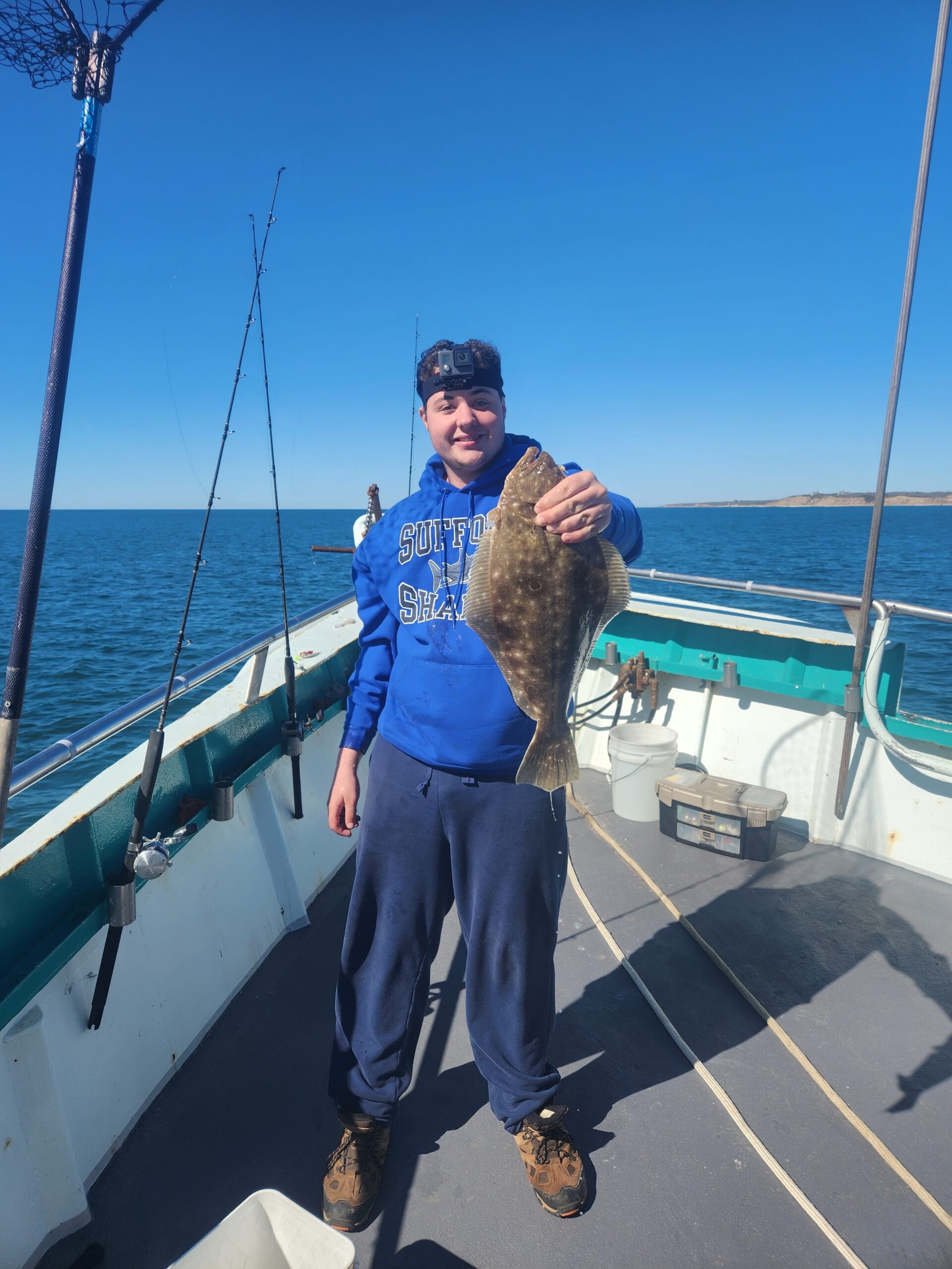 a man standing on a boat in the water