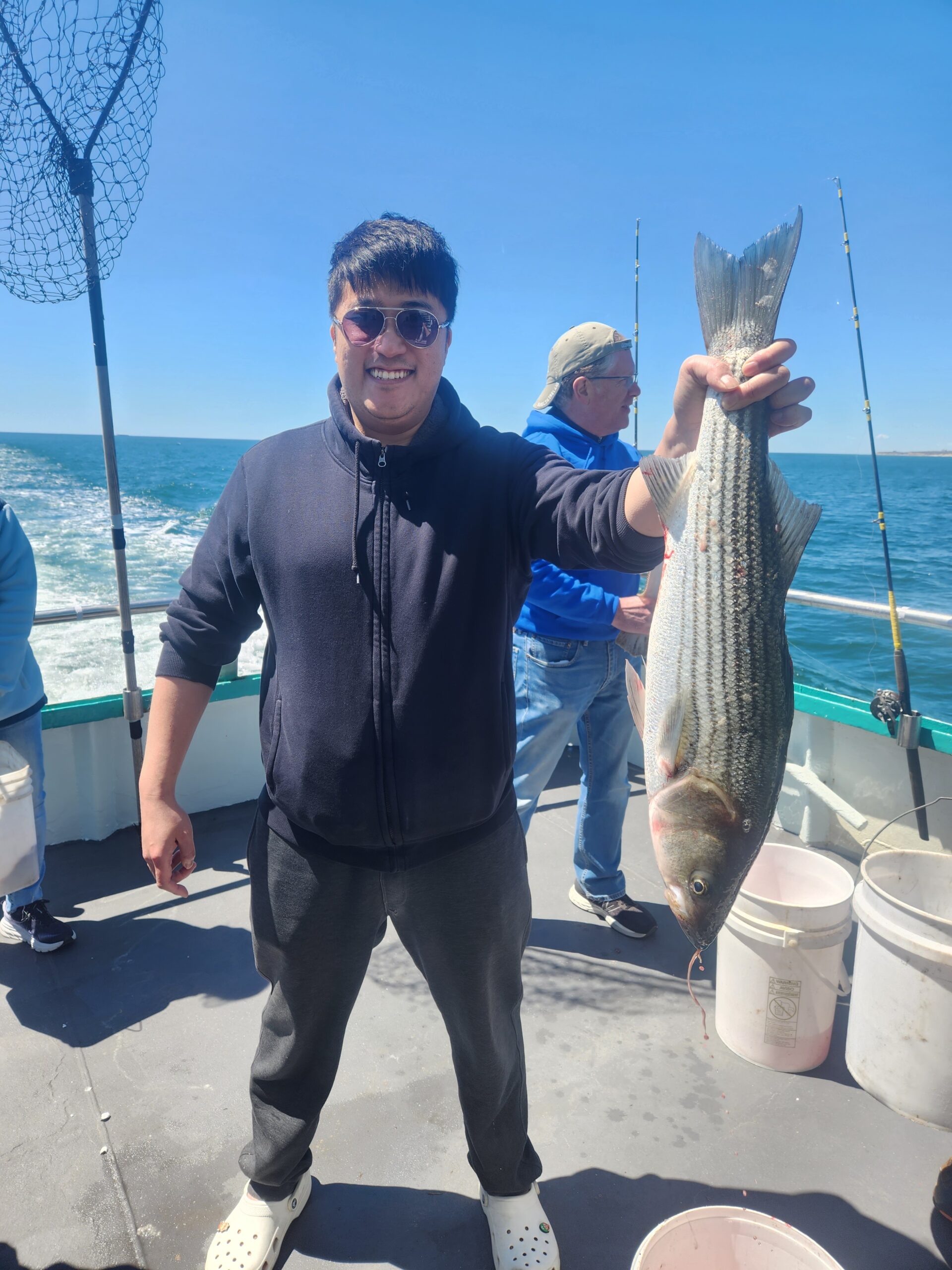 a man holding a fish