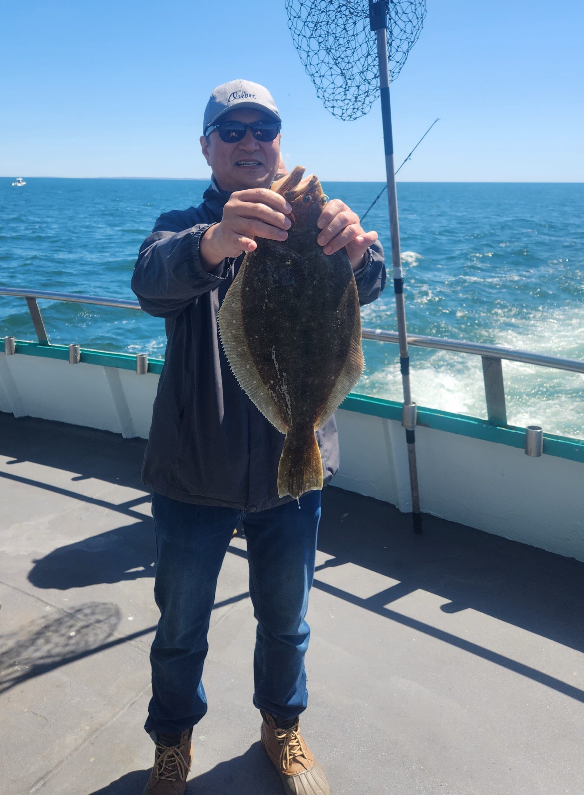 a person holding a fish in the water
