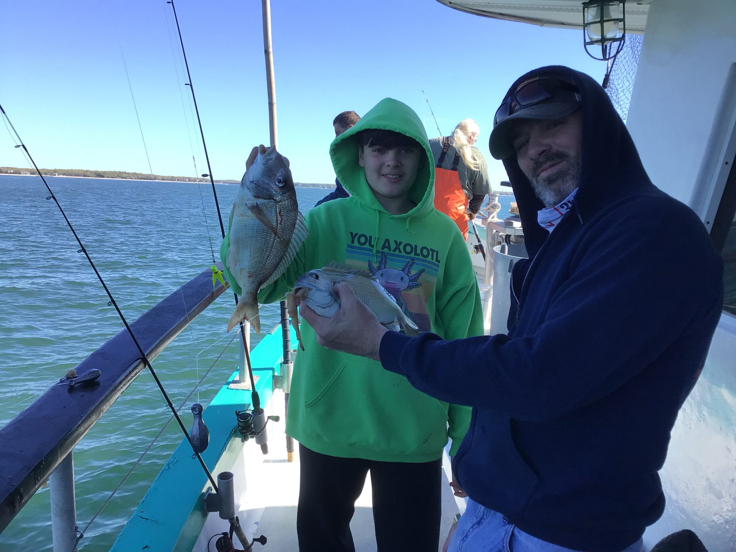 a person holding a fish in the water