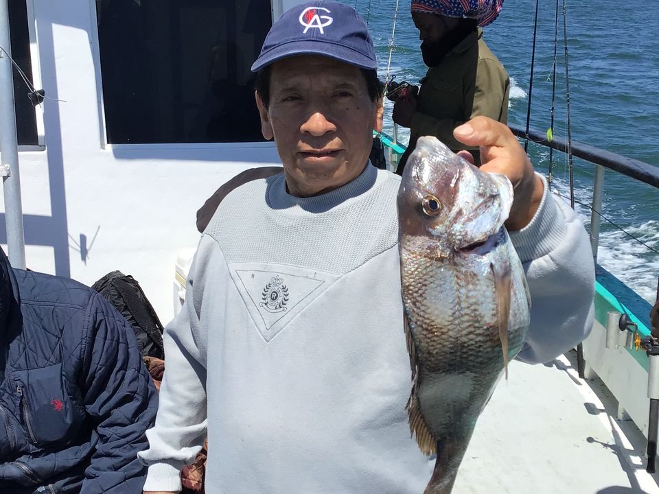 a man holding a fish