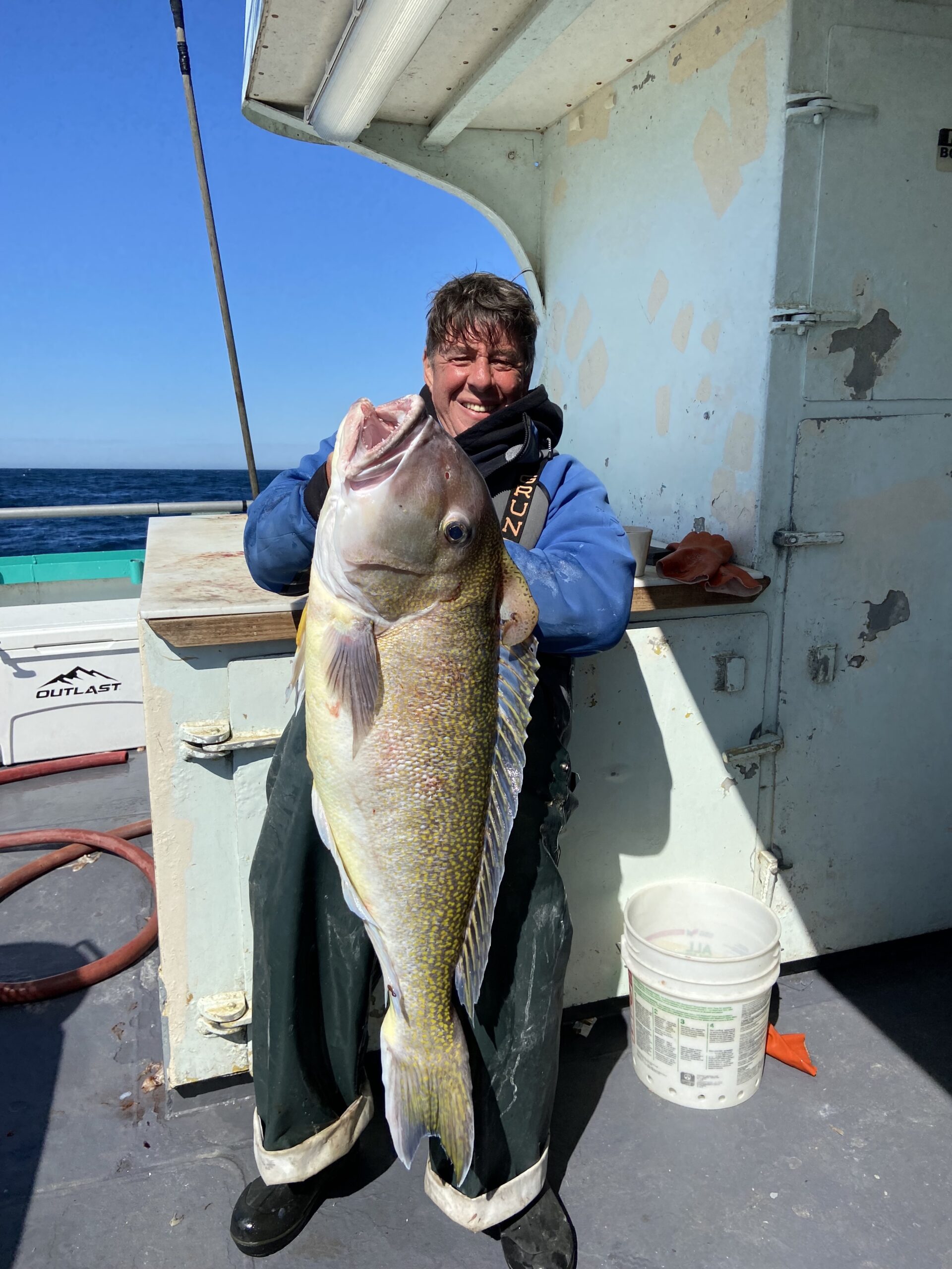 a man holding a fish