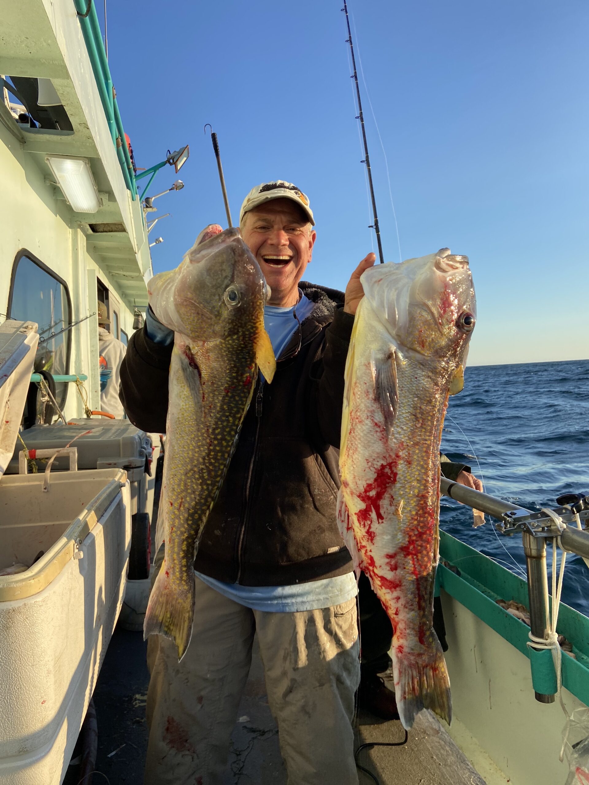 a man holding a fish