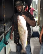 a person holding a fish