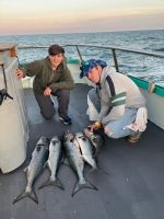 a person holding a fish in the water