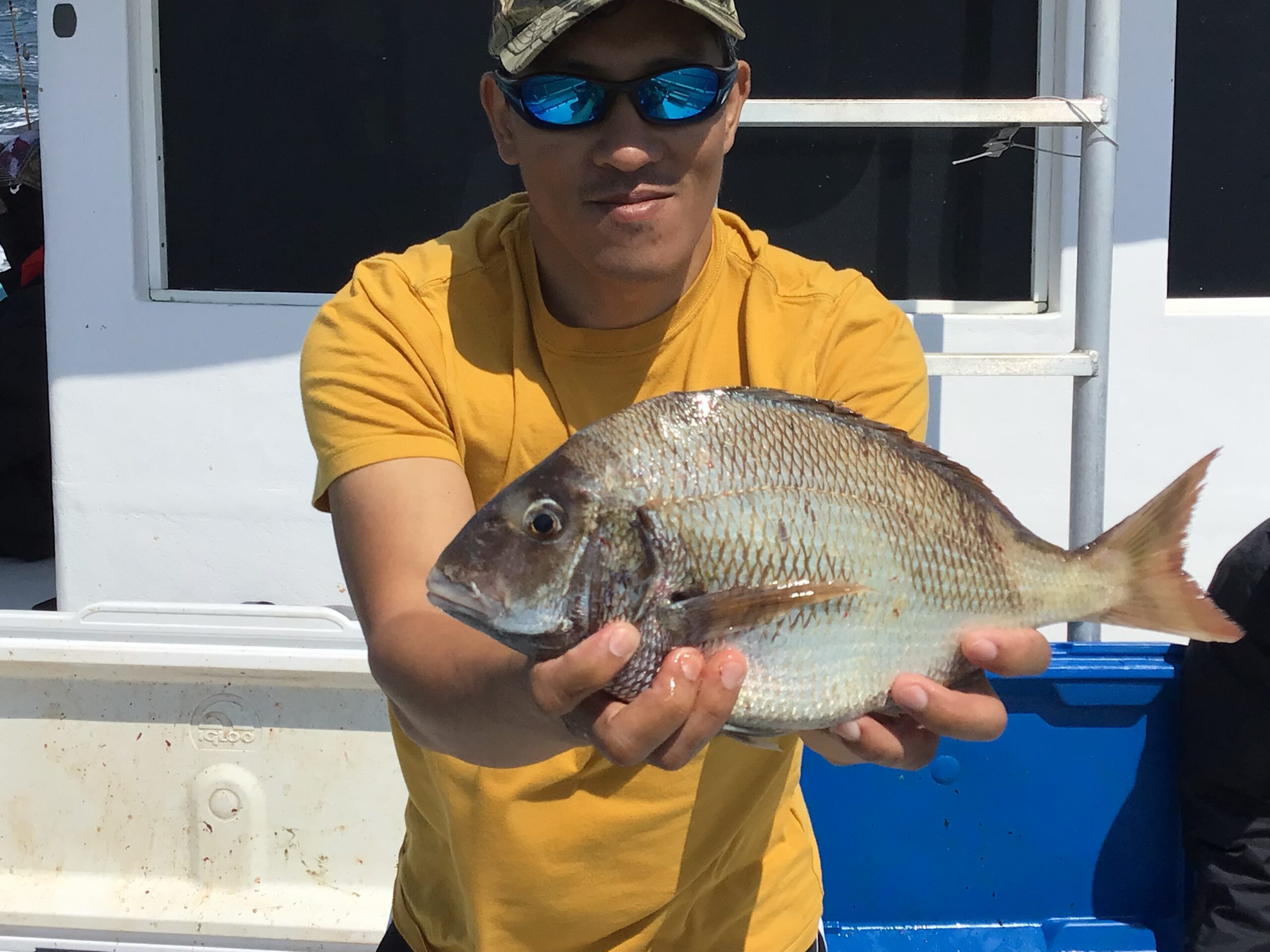 a person holding a fish