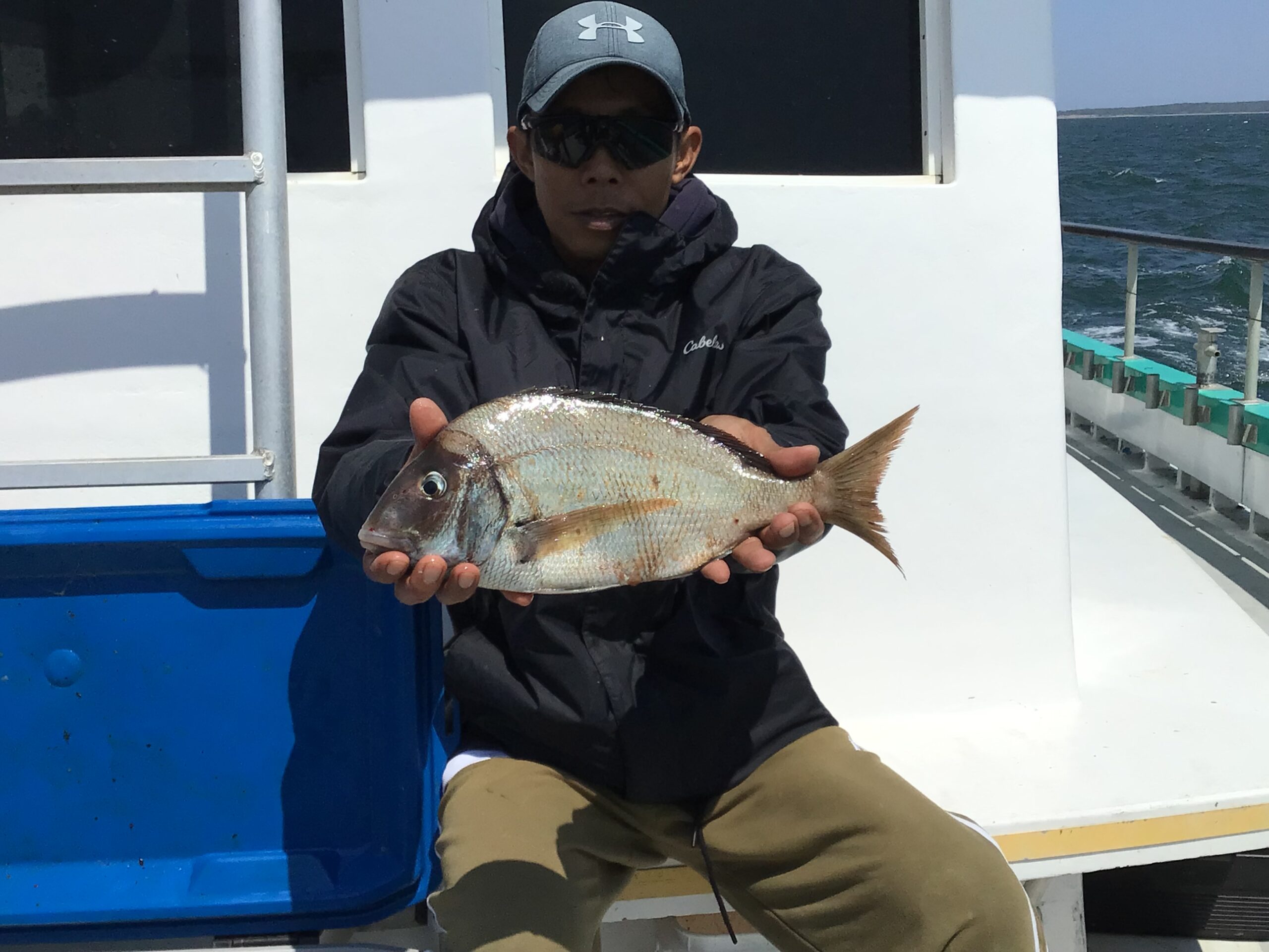 a man holding a fish