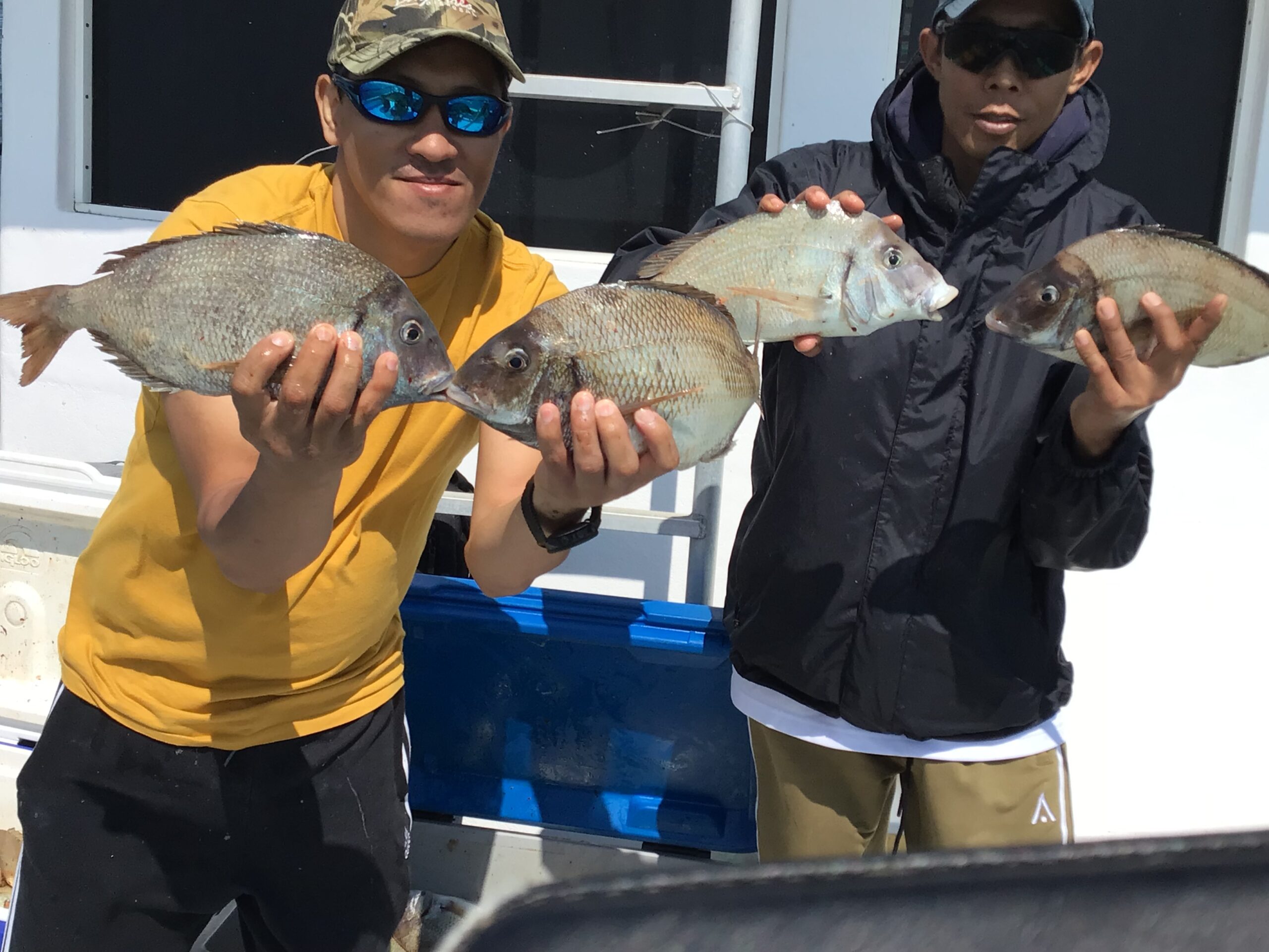 a woman holding a fish