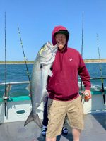 a man holding a fish