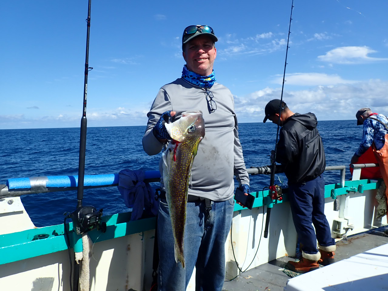a person holding a fish in the water