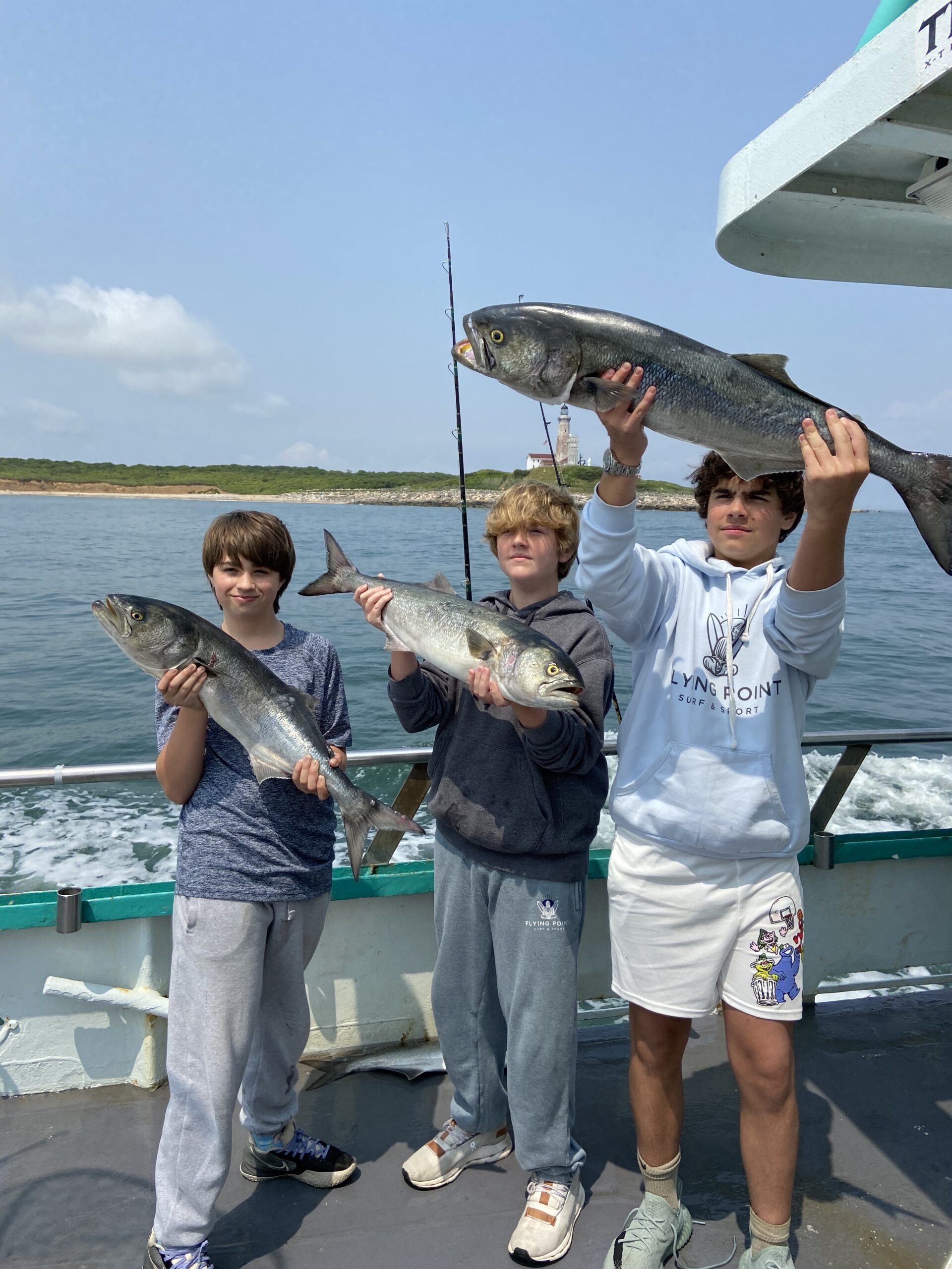 a man holding a fish in the water