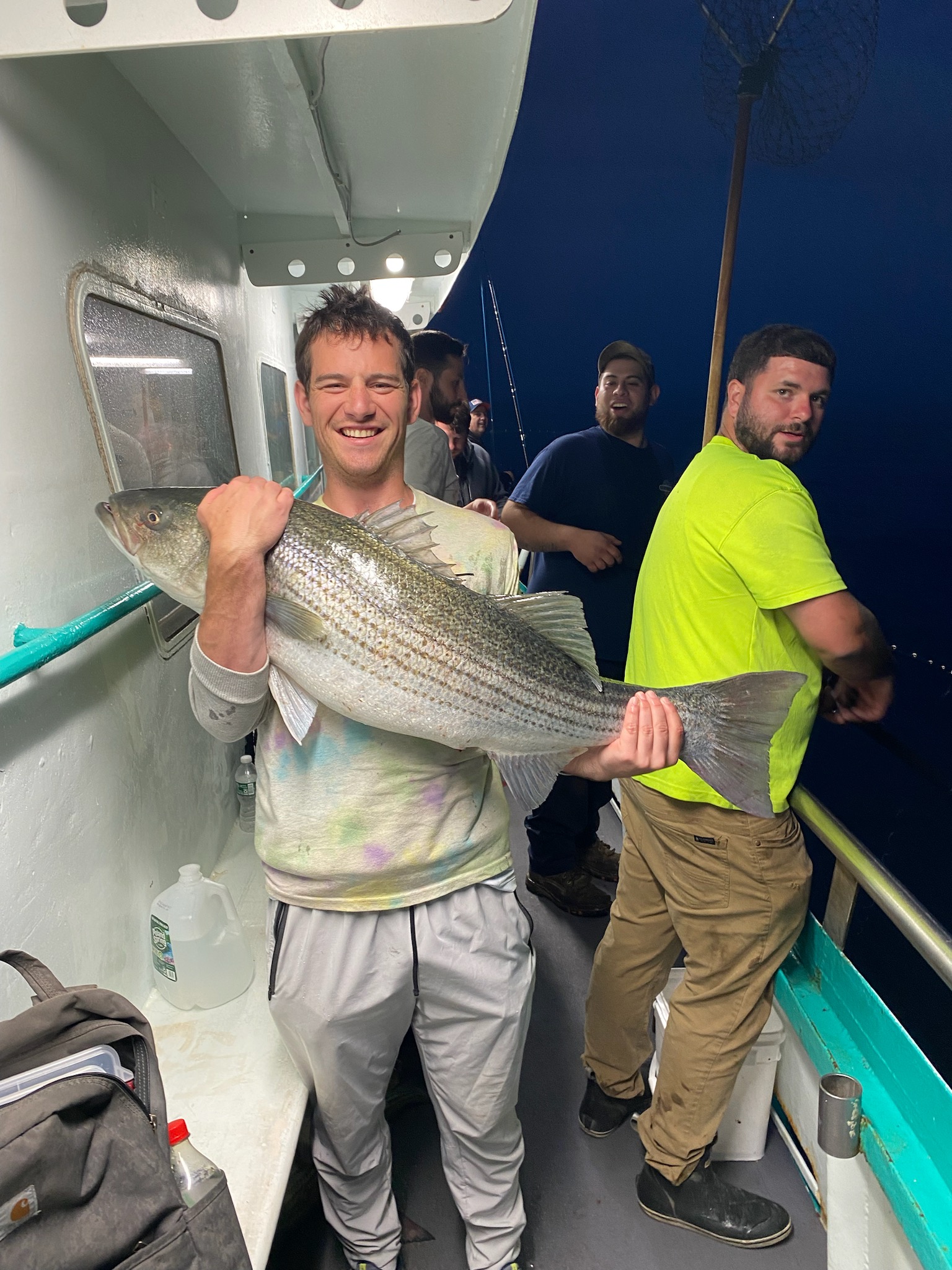 a person holding a fish