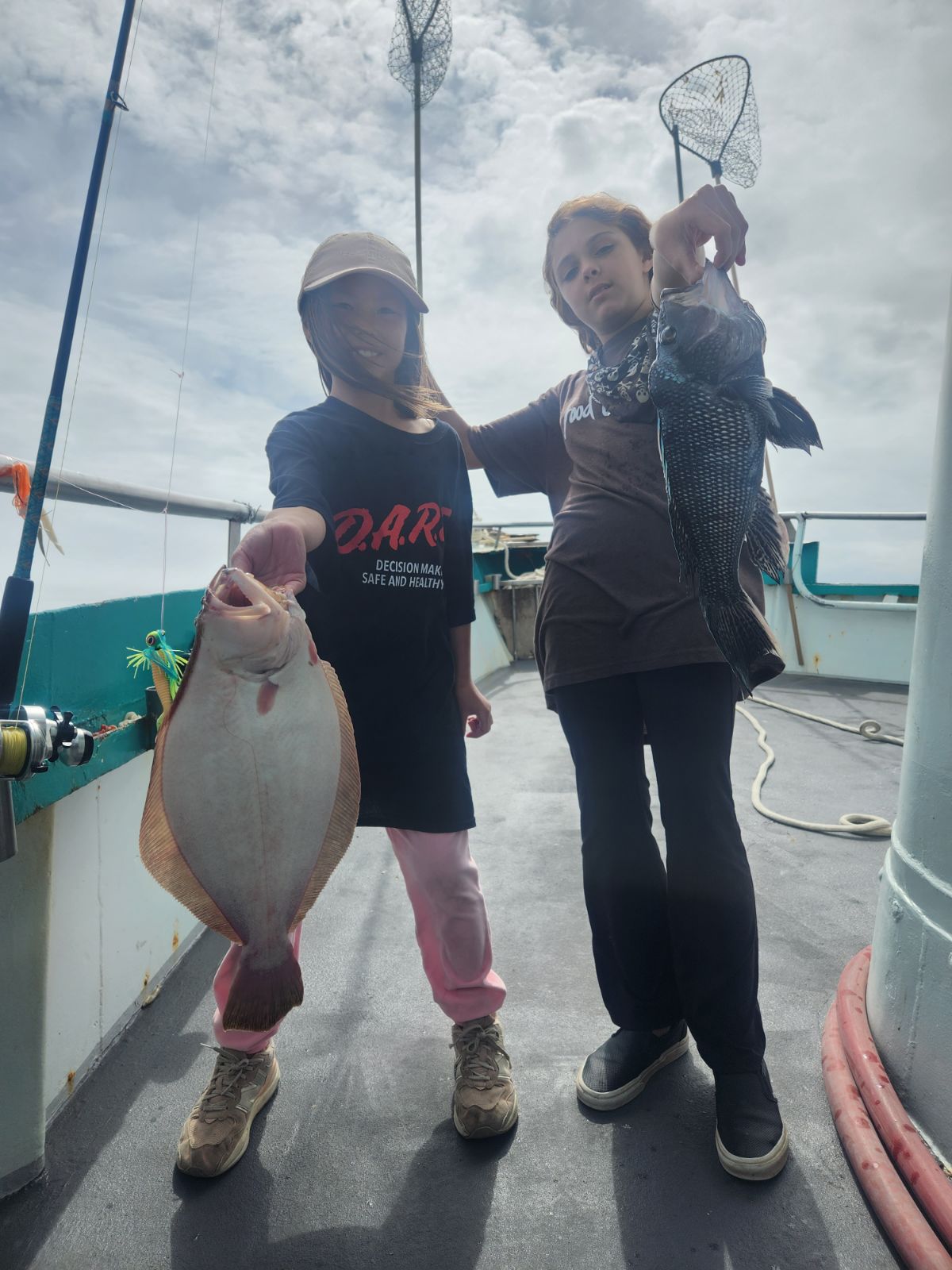 a group of people standing in a parking lot