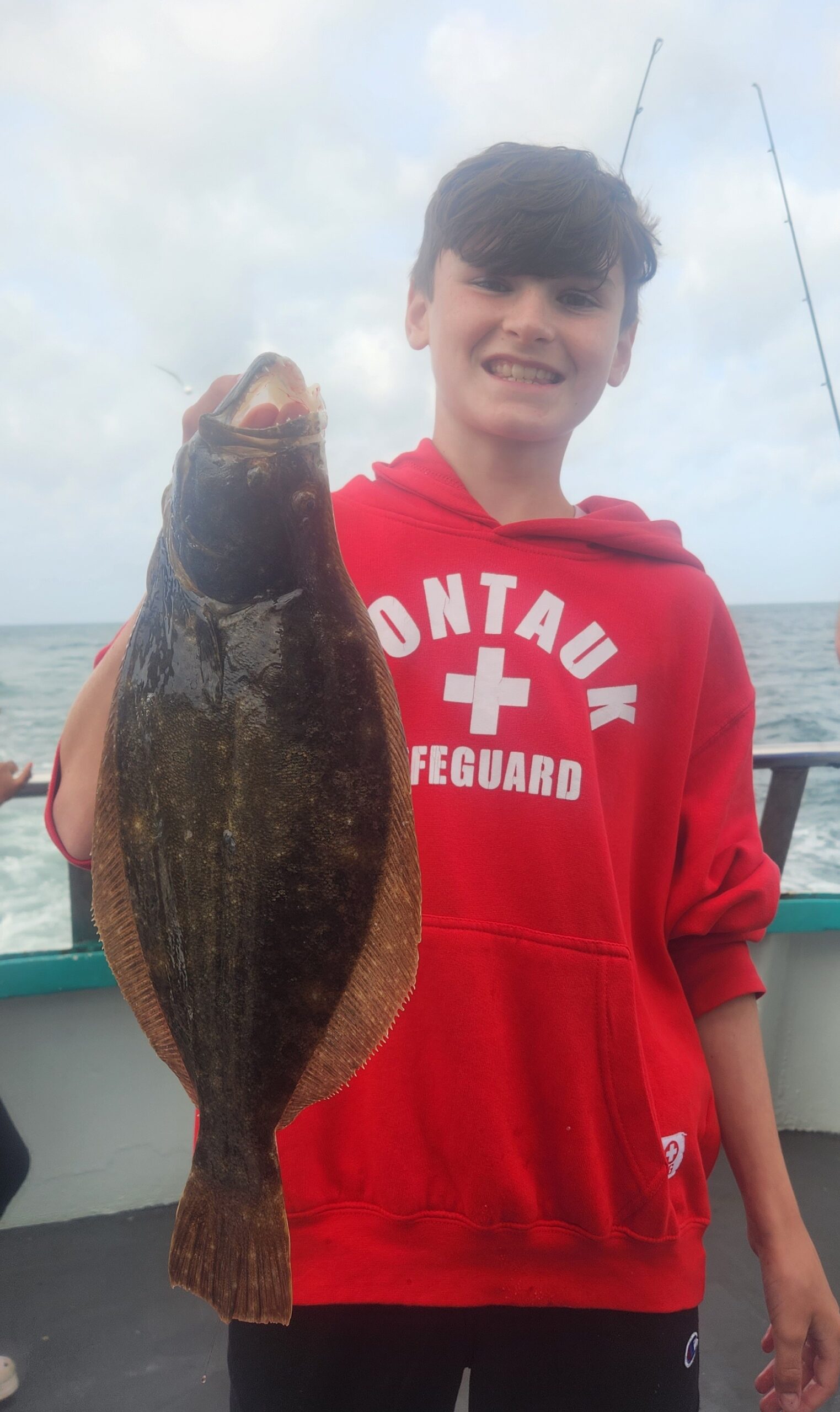 a person holding a fish