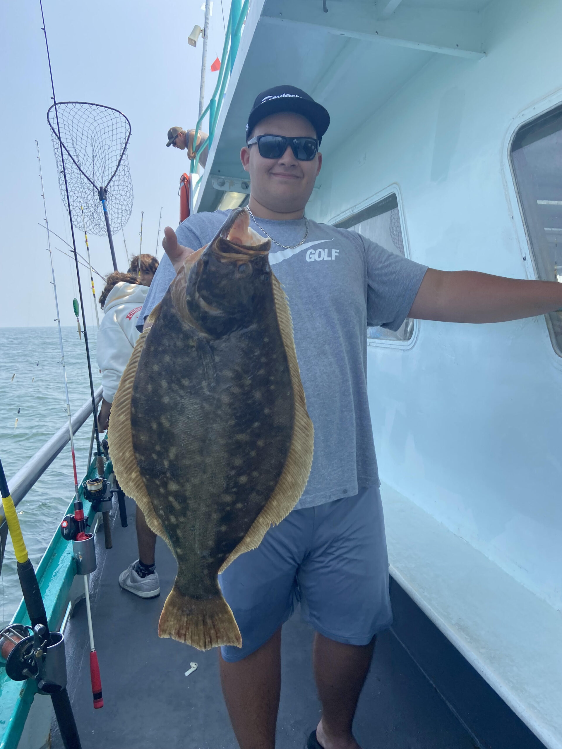 a man holding a fish