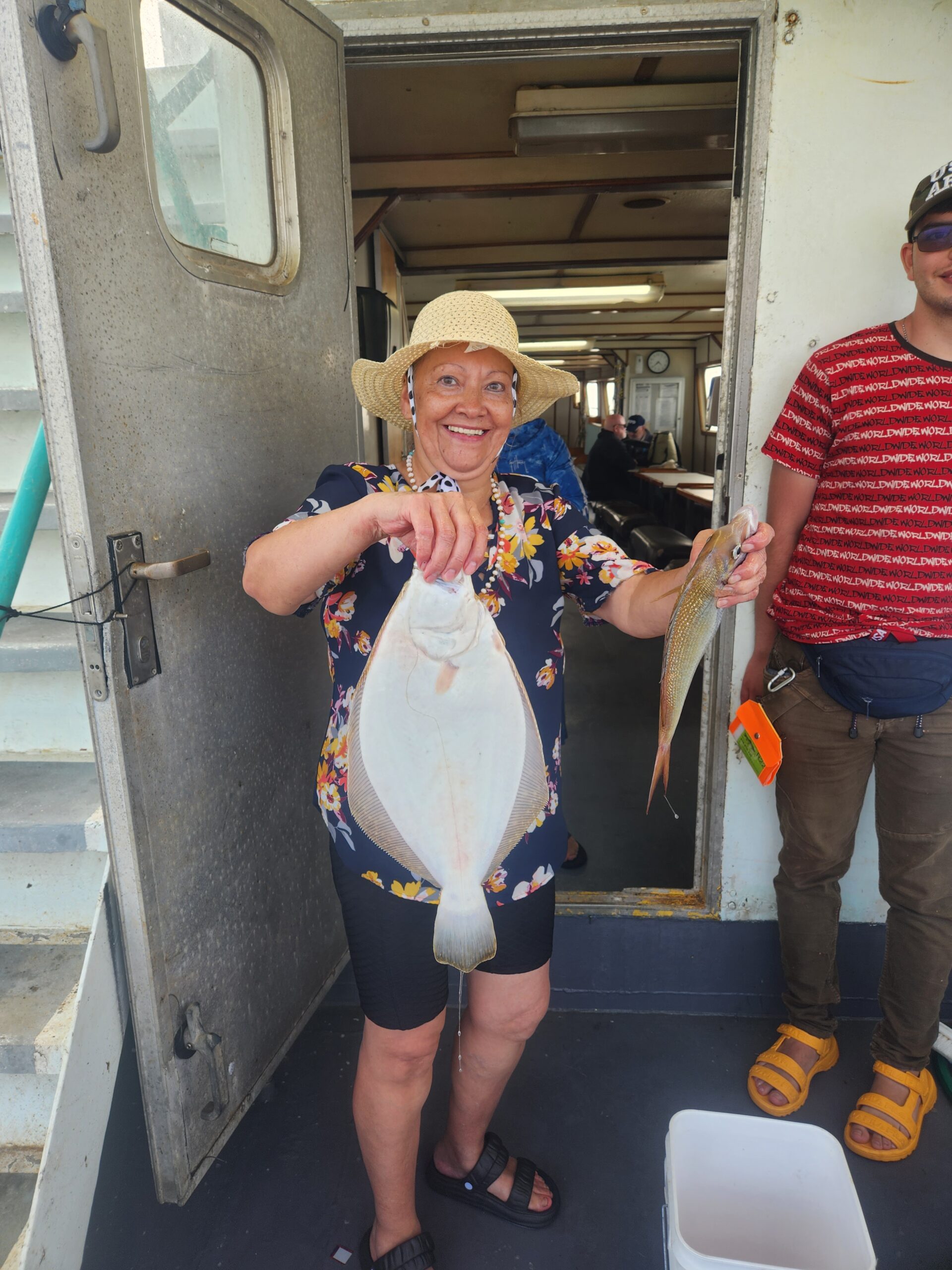 a man and a woman standing in front of a building