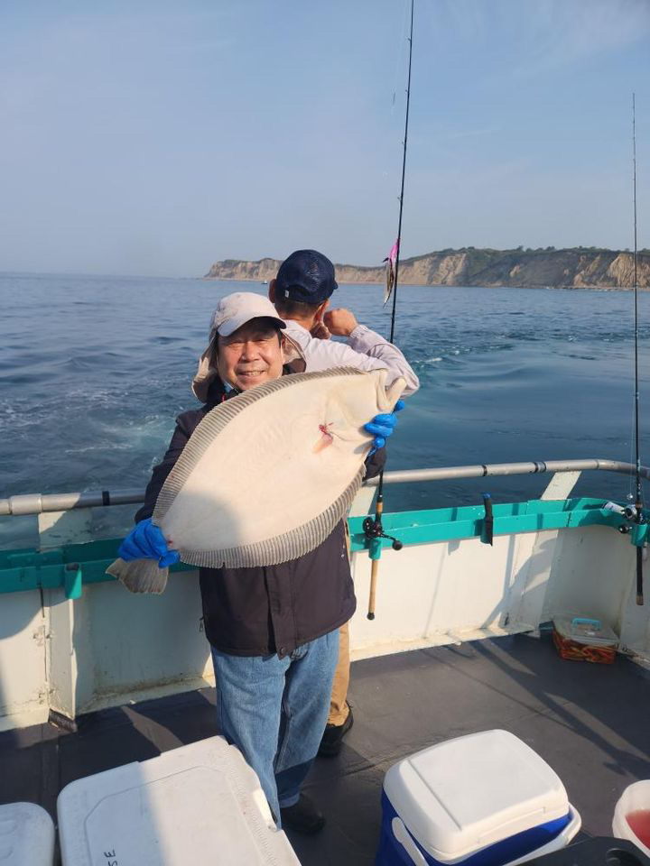 a man standing on a boat in the water