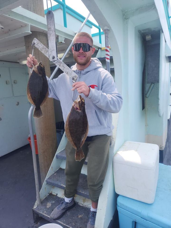 a person holding a fish