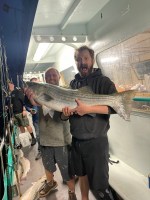 a man holding a fish