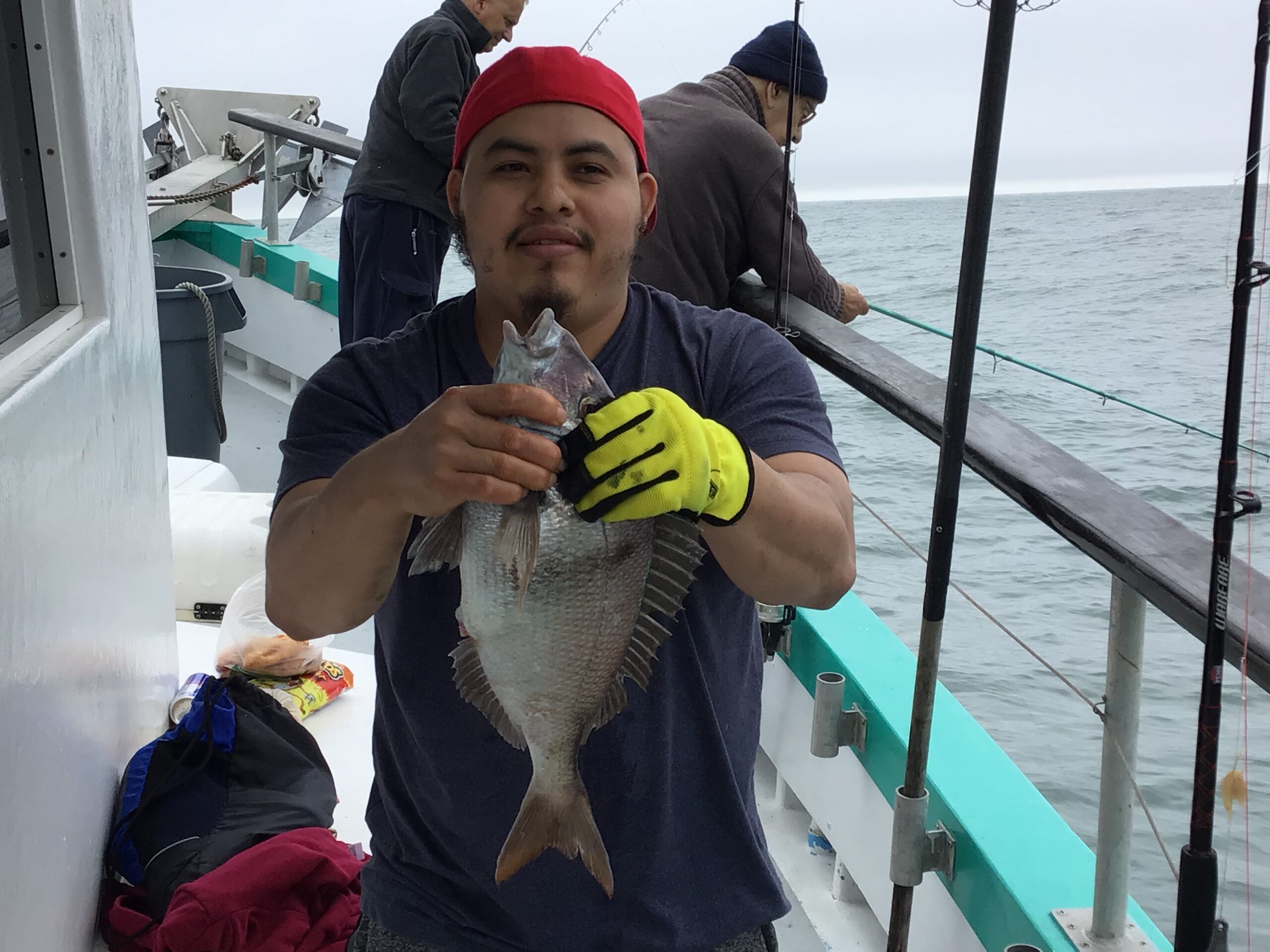 a person standing next to a boat