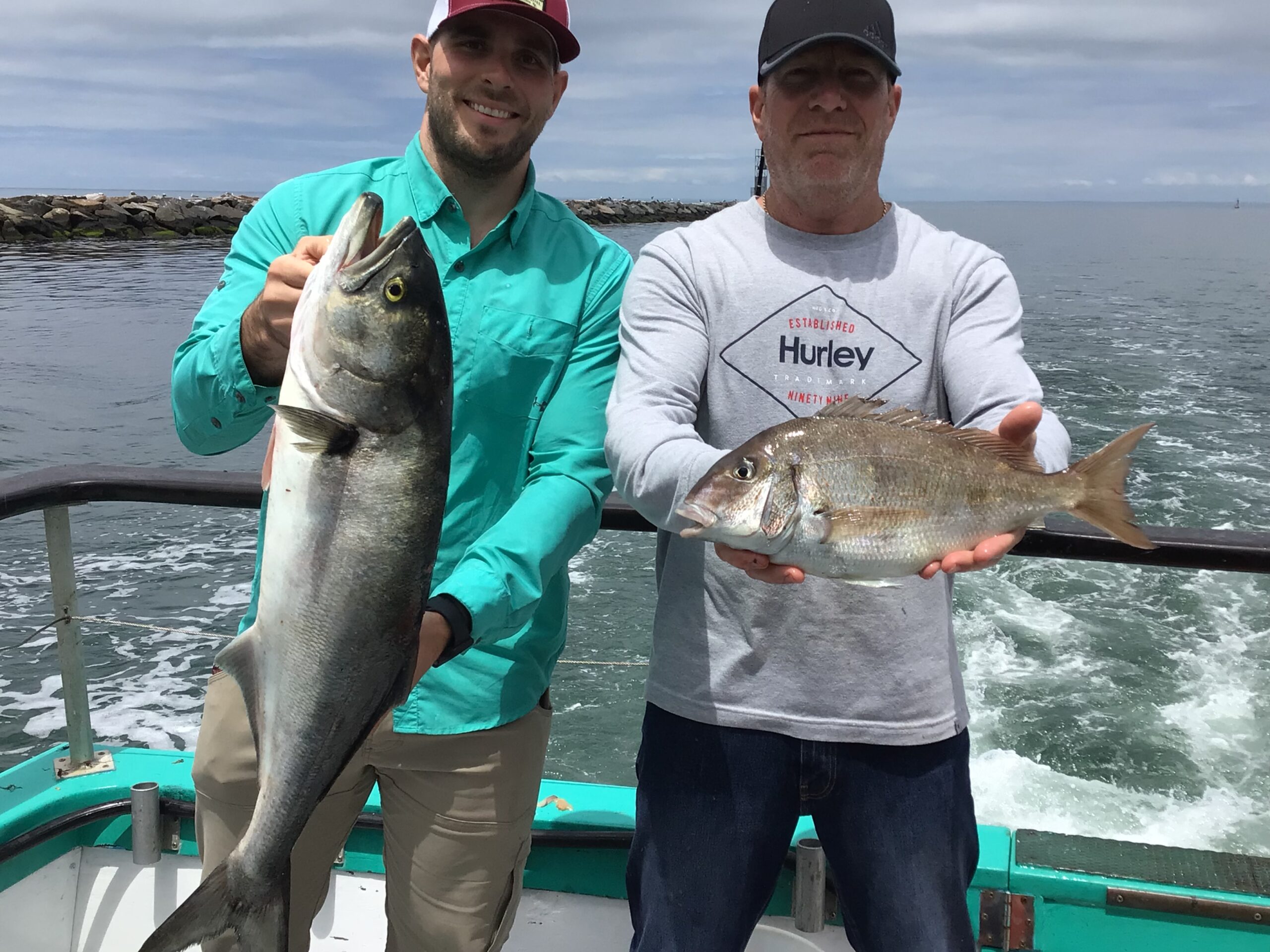 a person holding a fish in the water