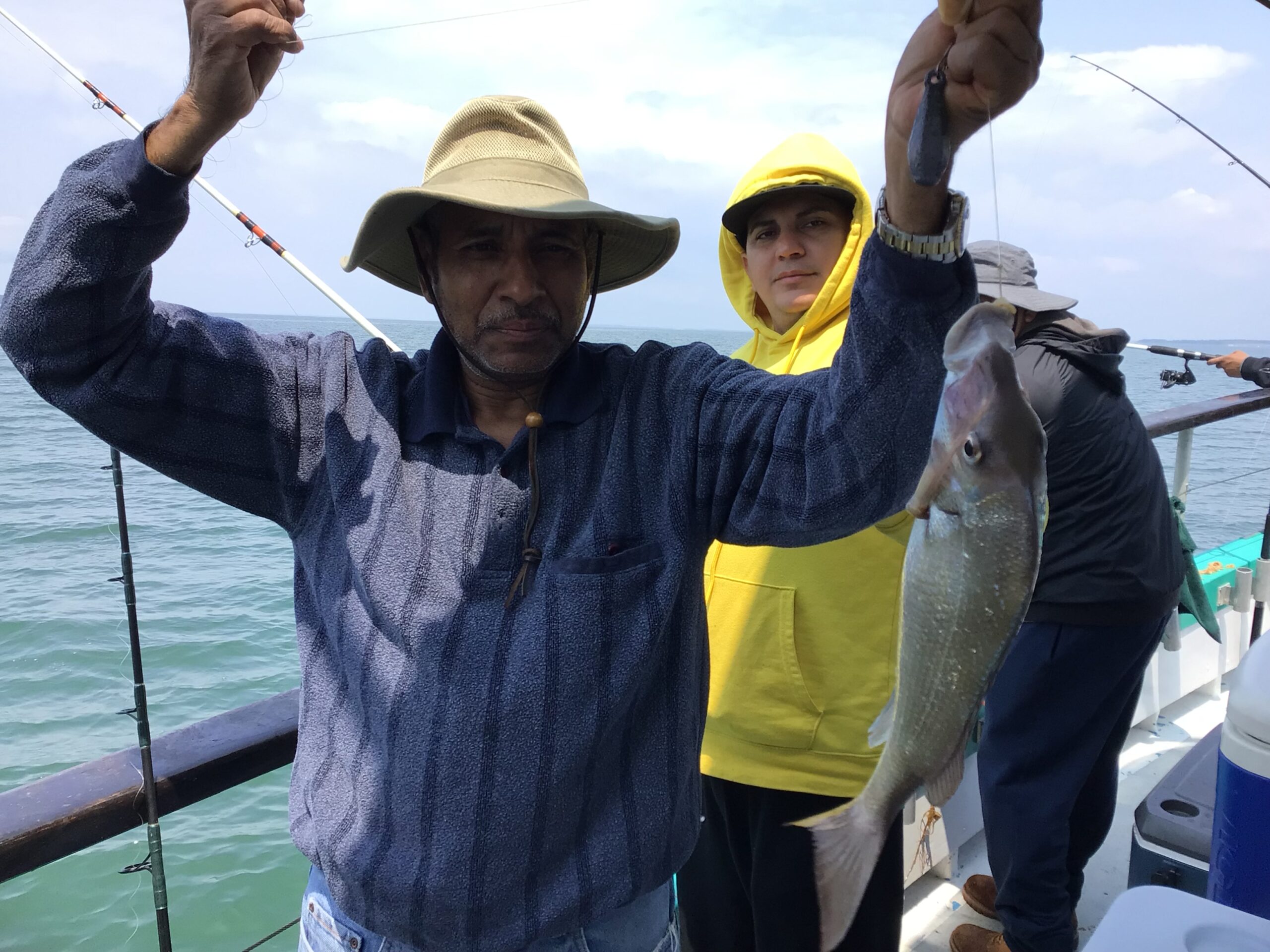 a person holding a fish in the water