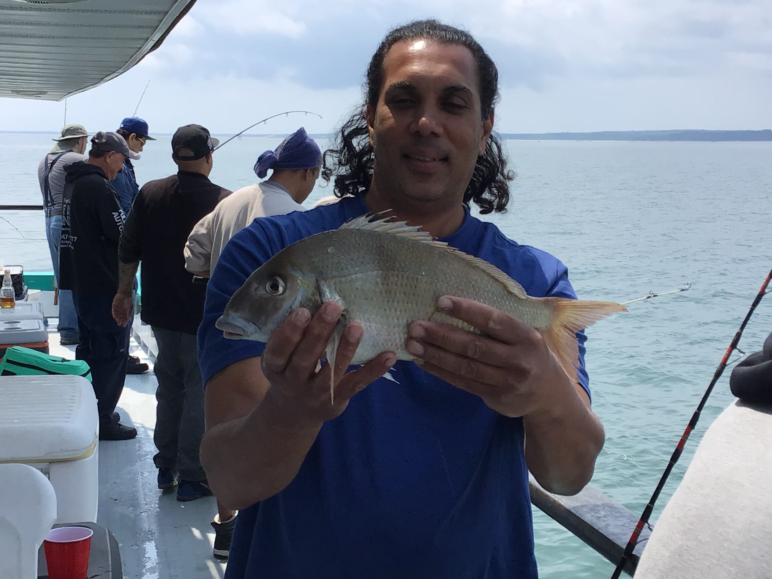a person holding a fish in the water